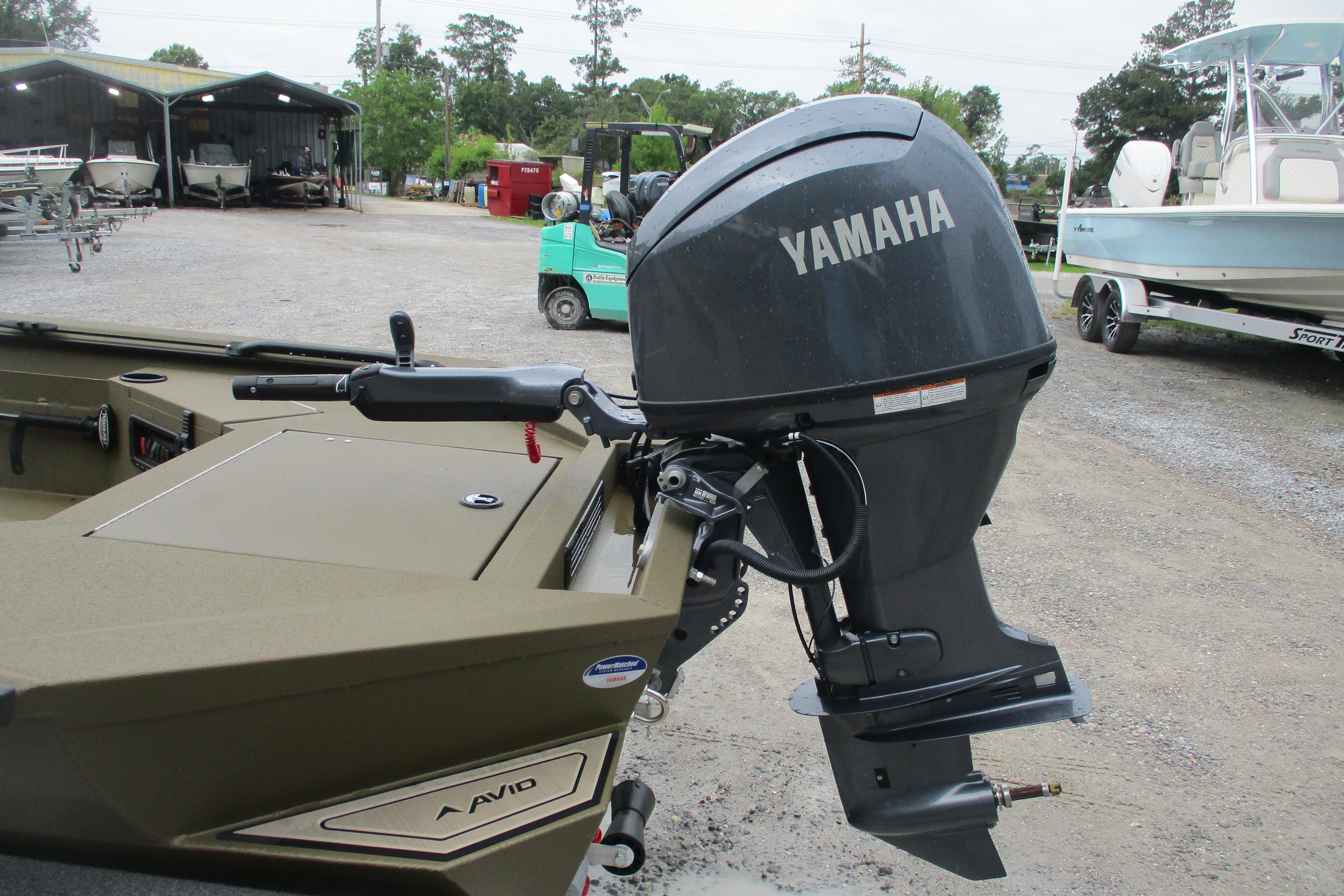 Avid 16 Commander 2026 boat with Yamaha outboard motor in a boatyard.