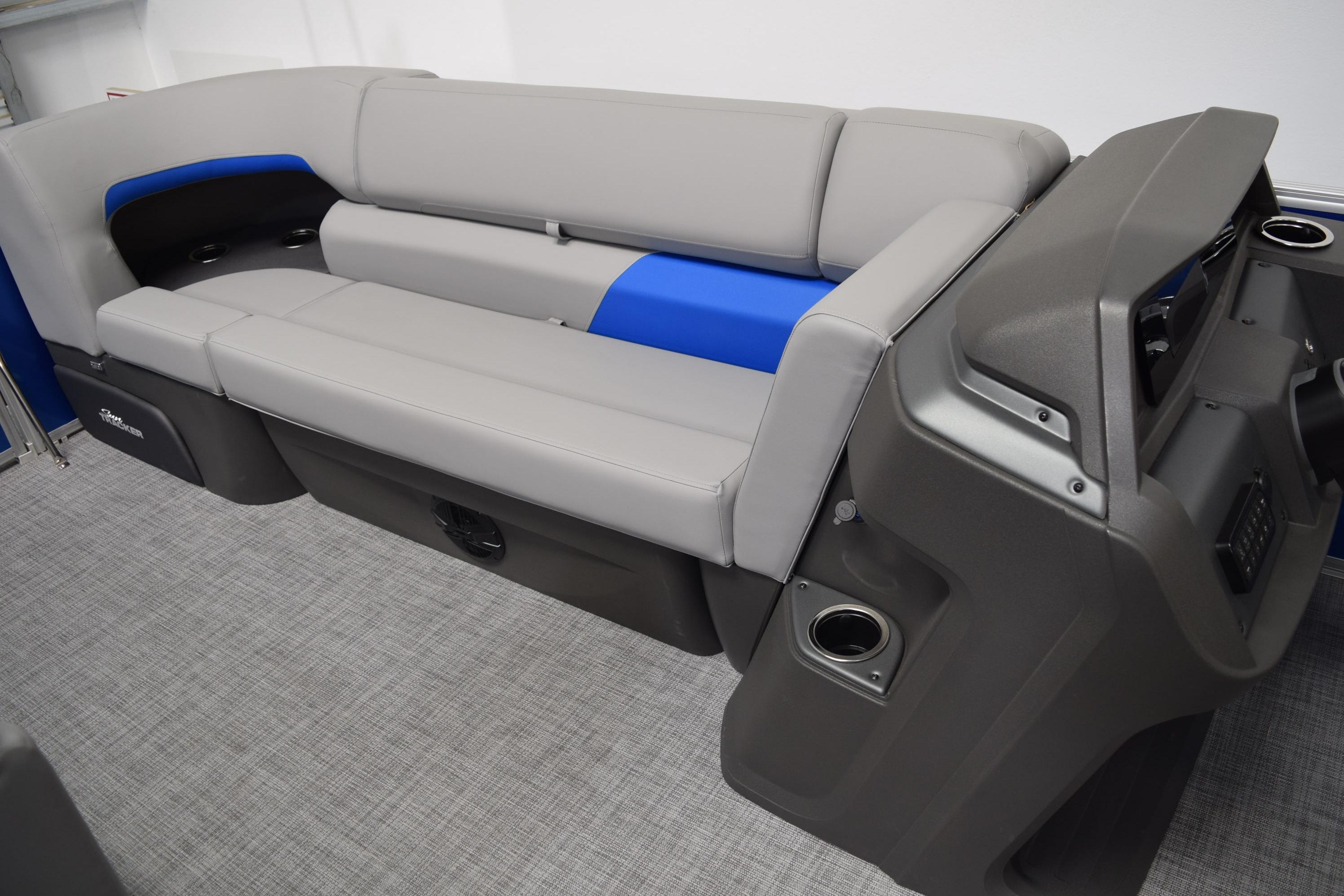 2026 Sun Tracker Party Barge 20 DLX interior with gray and blue seating.