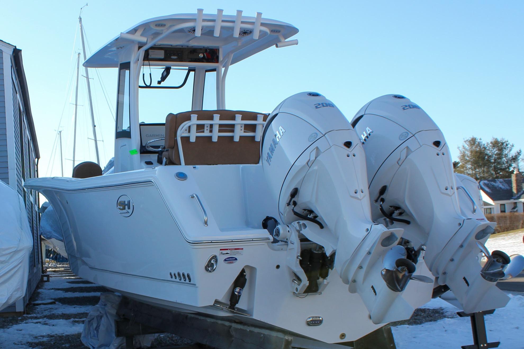 2026 Sea Hunt Gamefish 25 boat with dual Yamaha outboard engines.