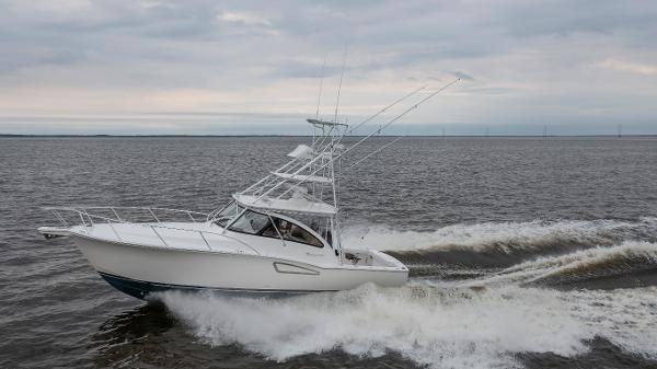 2025 Albemarle 36 Express boat cruising on open water under cloudy skies.