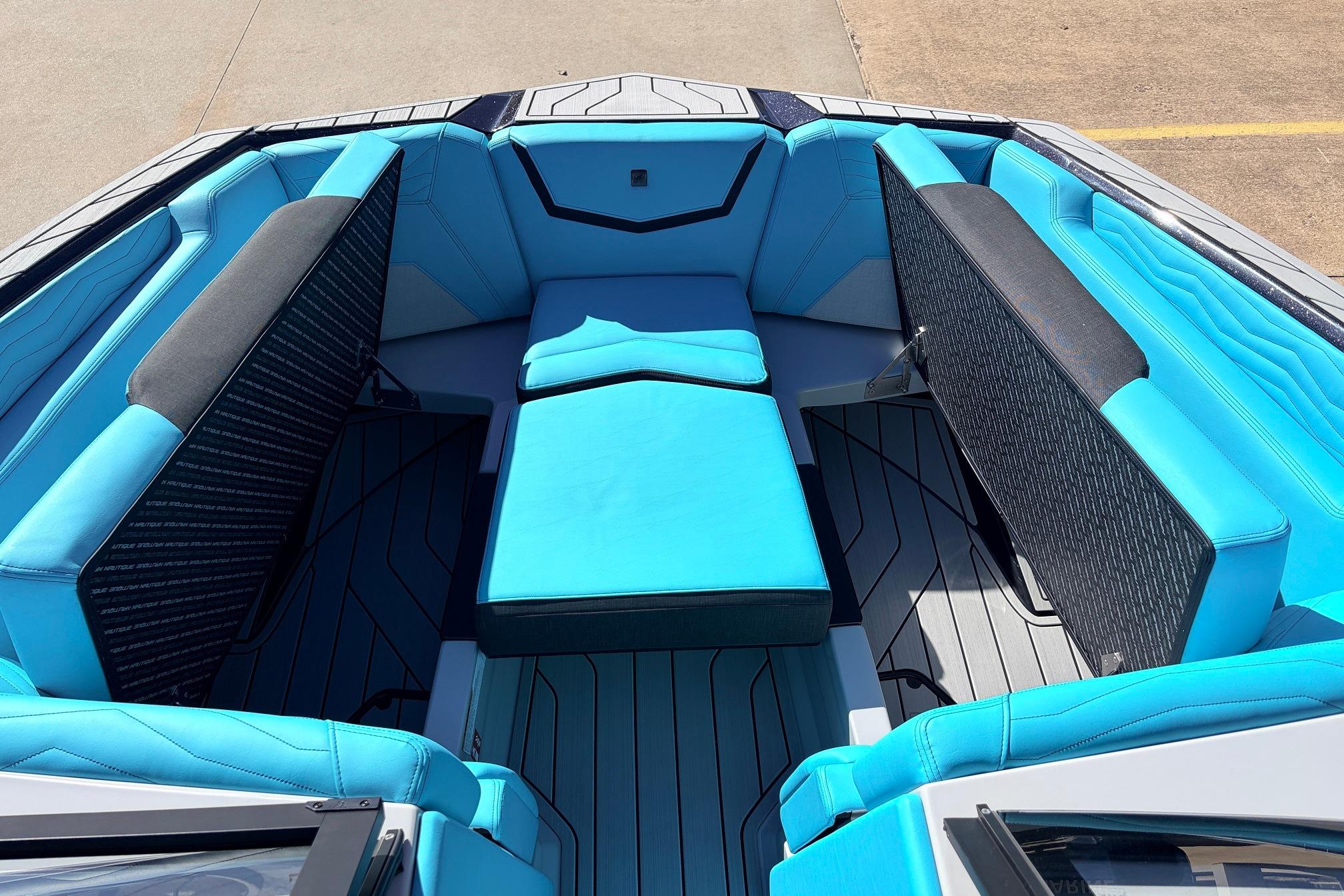Interior view of 2026 Nautique Super Air Nautique G23 boat with blue seating.