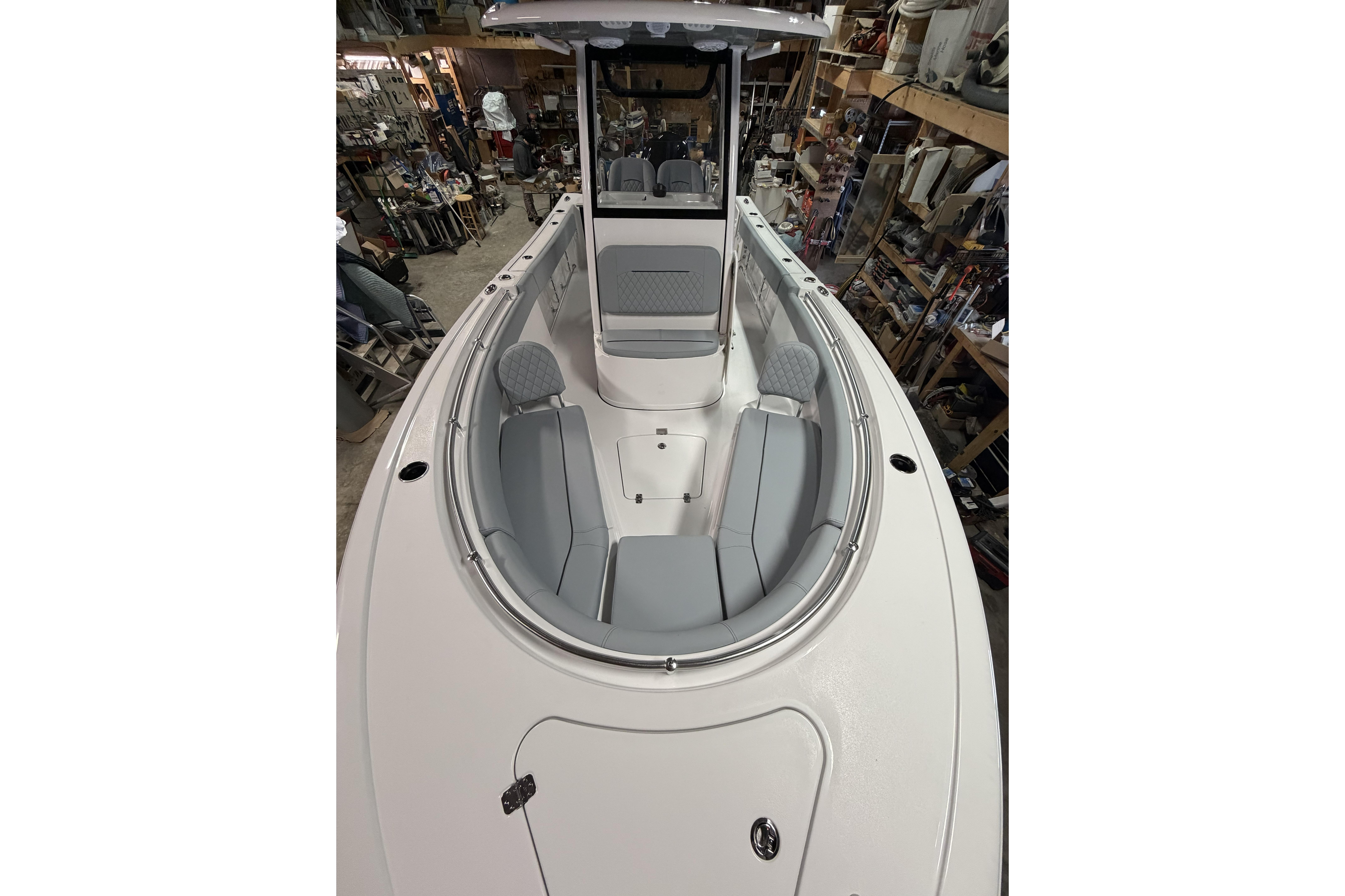 2026 Sportsman Open 232 Center Console boat interior with seating and console view.