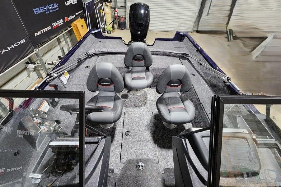 2026 Tracker Pro Guide V-175 Combo boat interior with four gray seats and control panel.