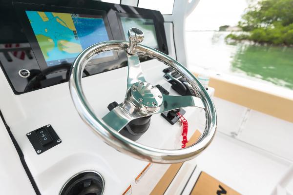 Manufacturer Provided Image: 2025 Sportsman Heritage 231 Center Console steering wheel and navigation display.
