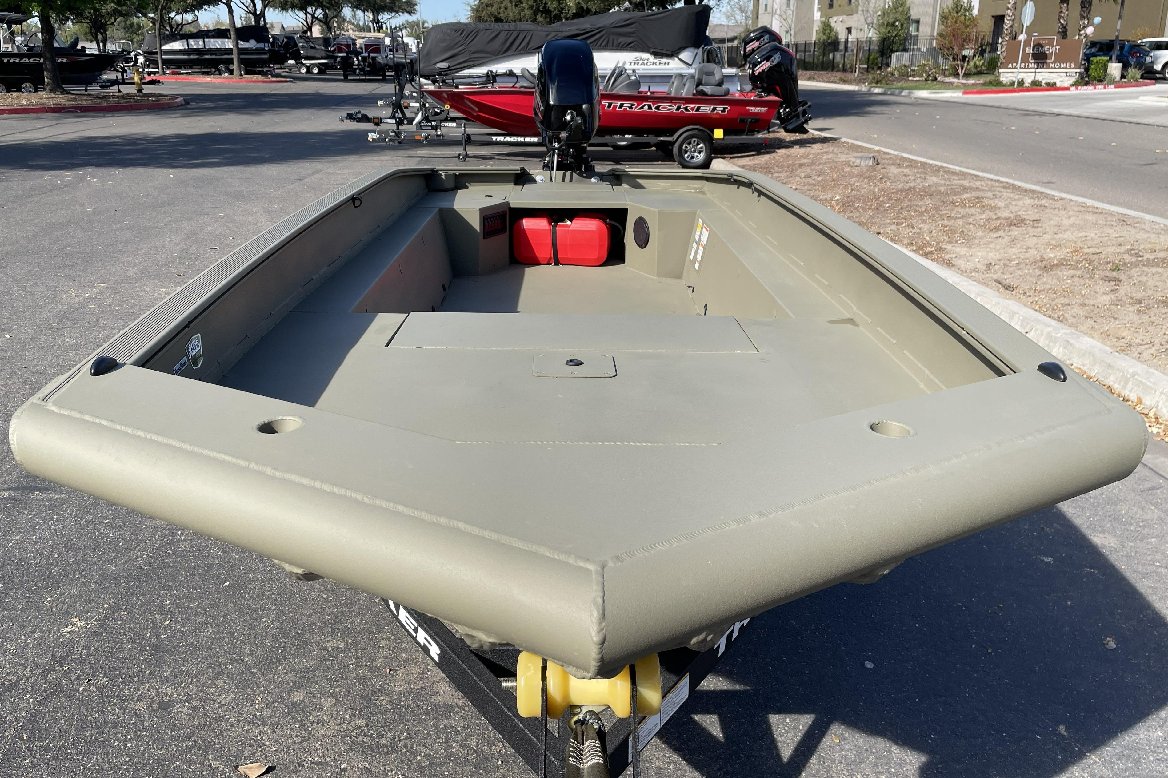 2026 Tracker Grizzly 1650 T Prairie Wings Edition boat in parking lot, front view.