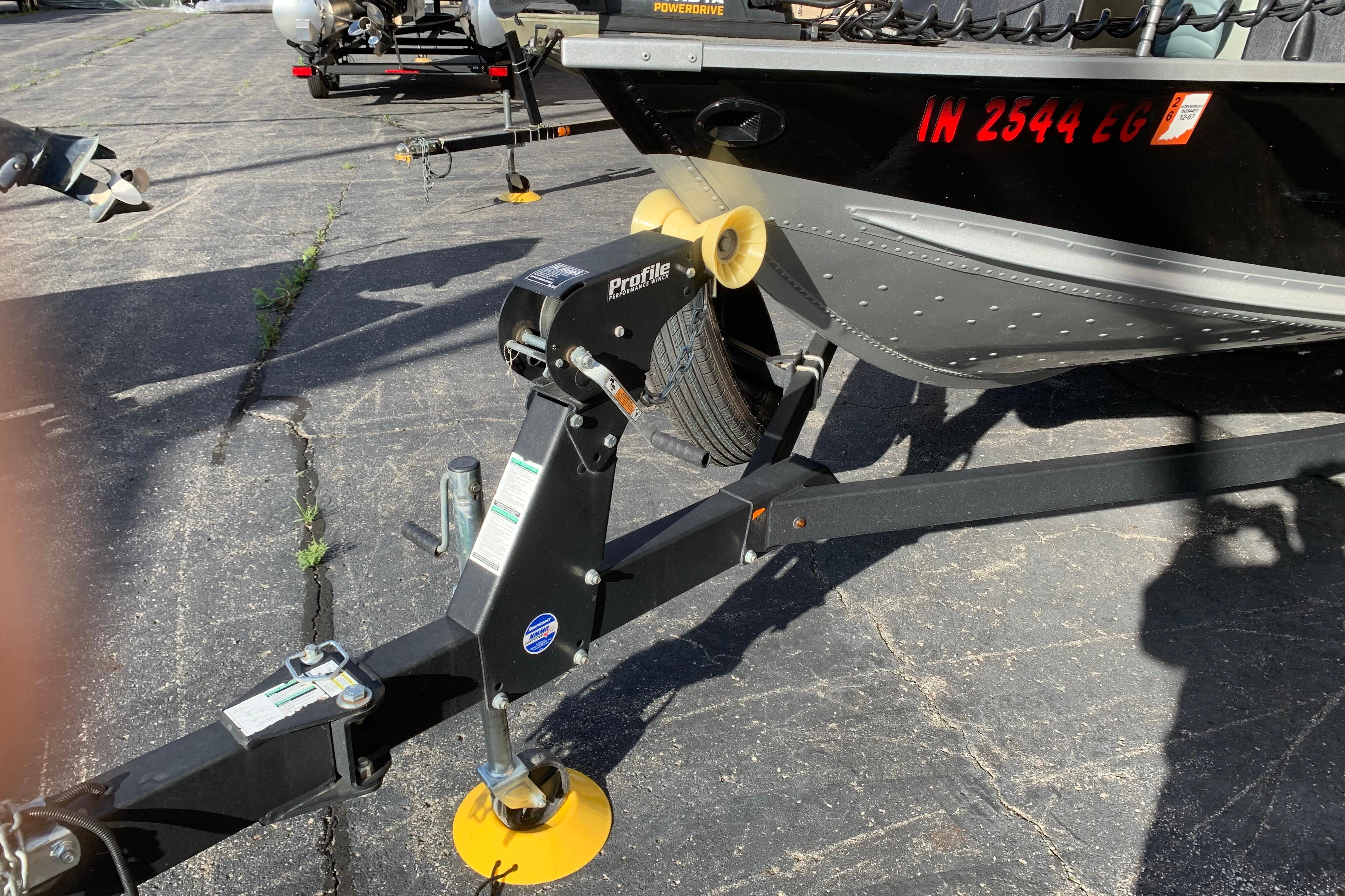 Trailer hitch of a 1993 Alumacraft Trophy 175 boat on pavement.