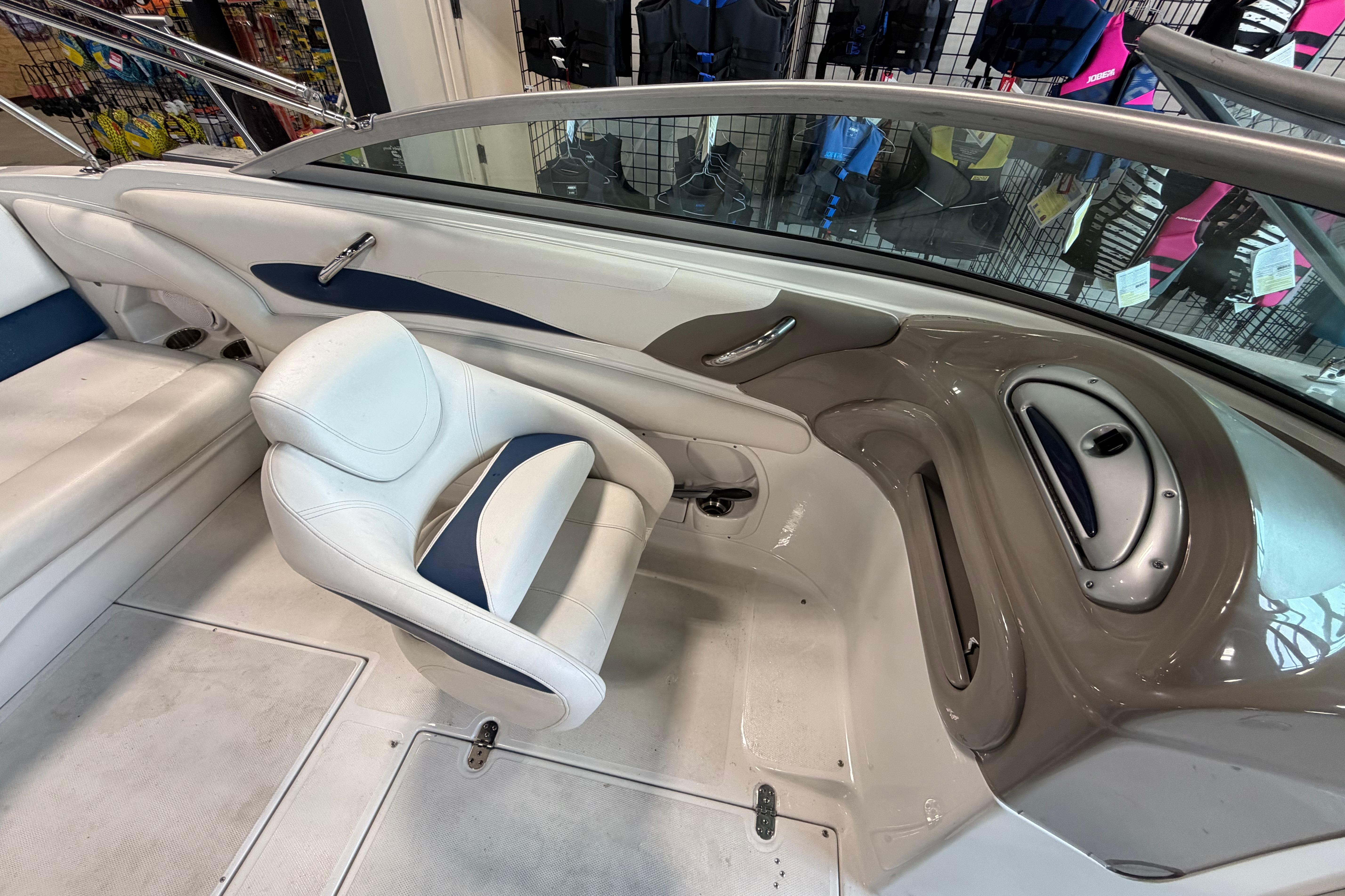 Interior of a 2008 Crownline 220 LS boat, featuring white and blue seating.