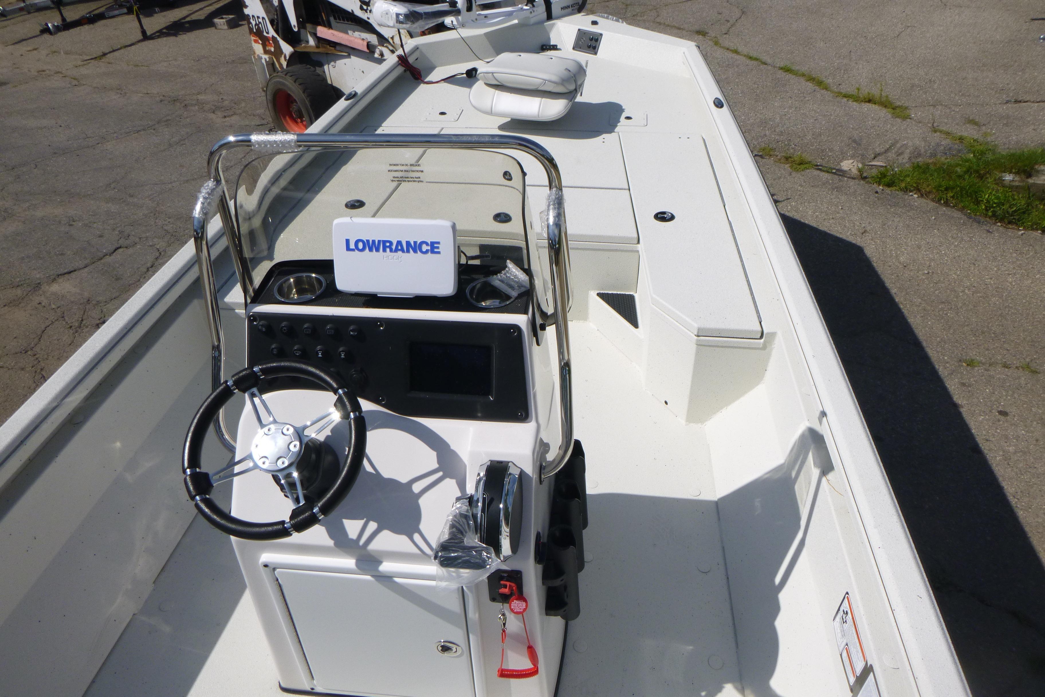 2025 Ranger RB210 boat interior with steering console and Lowrance navigation system.