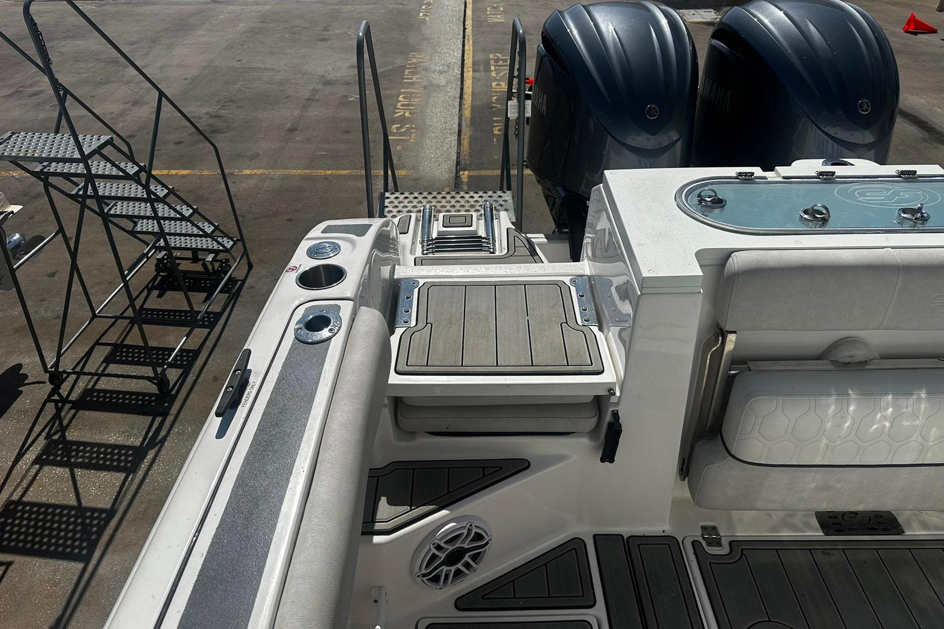 Sea Fox 228 Commander boat interior with dual engines and seating, 2002 model.