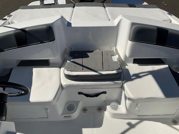 2025 Tahoe T18 boat interior with white seating and storage compartments.
