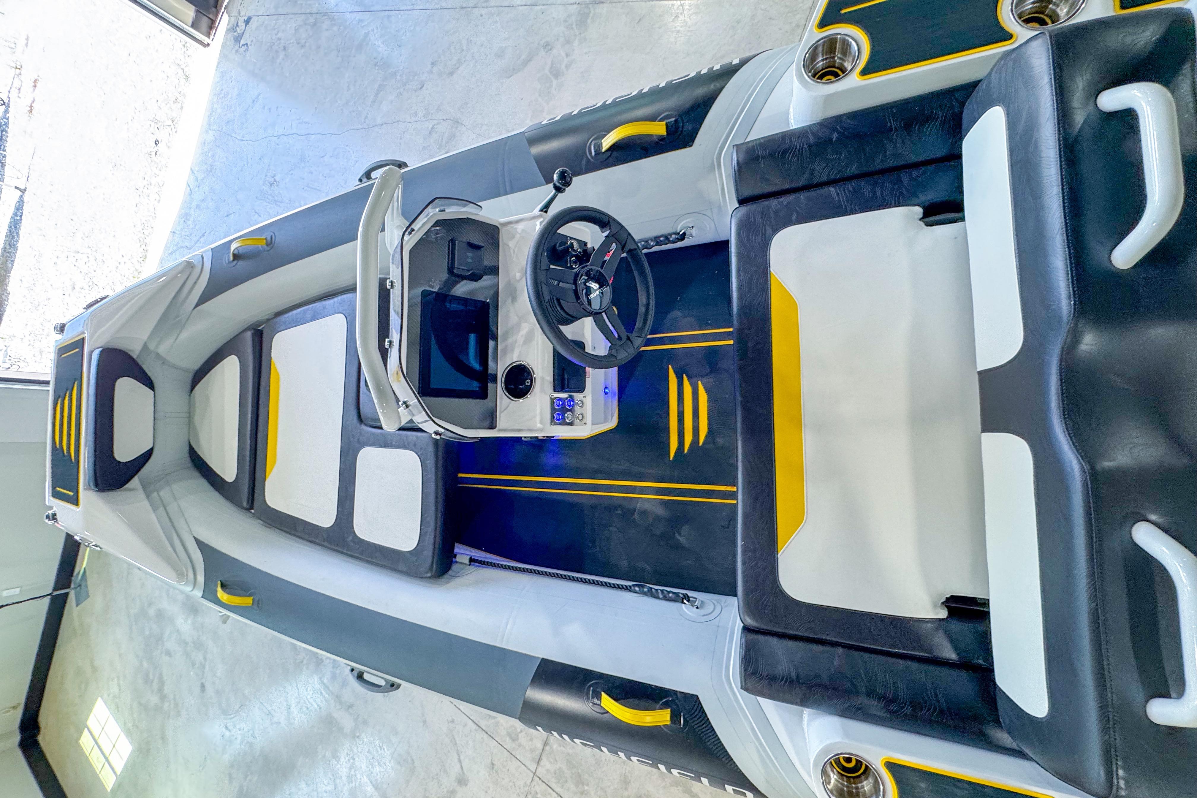 2025 Highfield Velox 420 boat interior with modern design, featuring black and yellow accents.