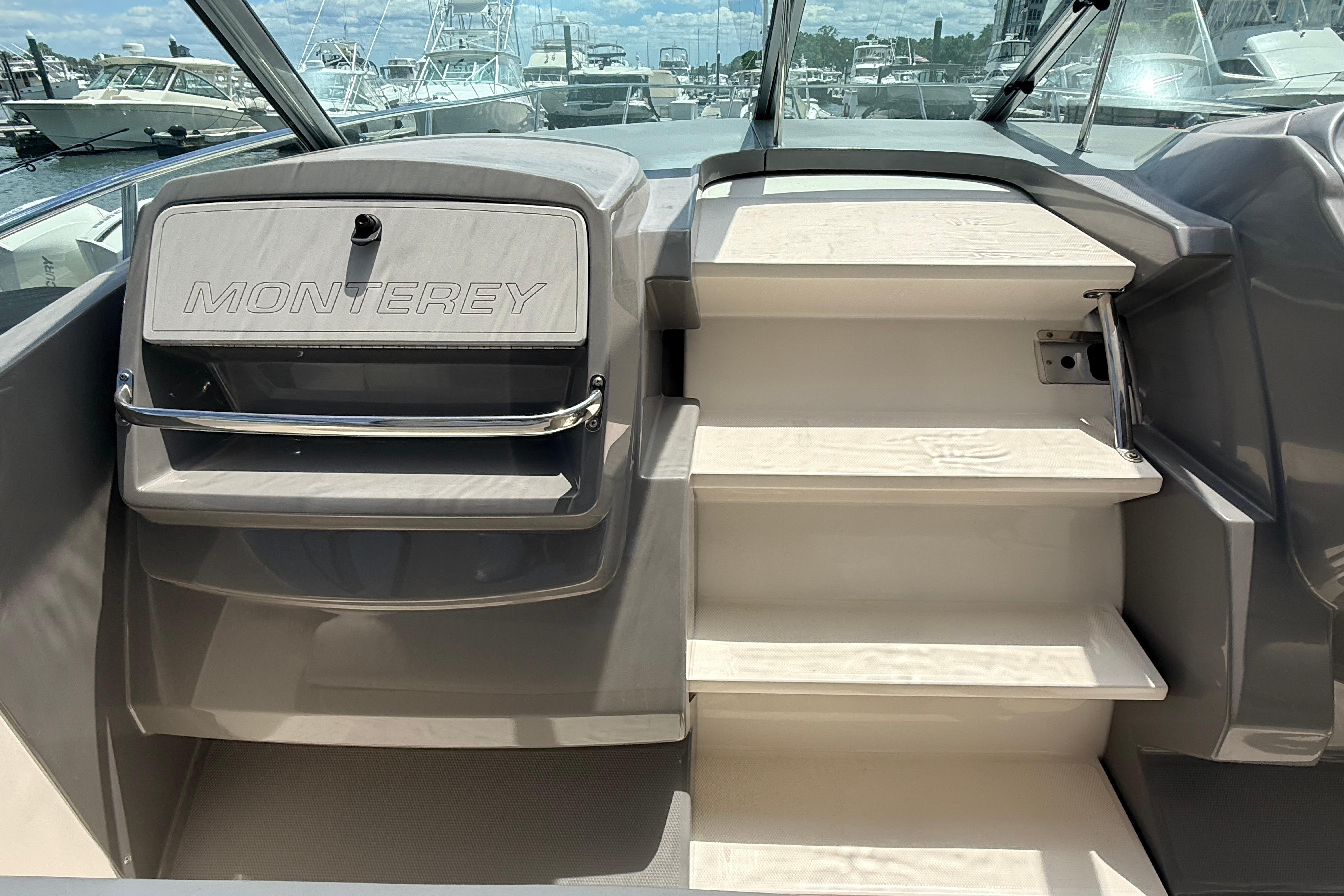 2011 Monterey 320 Sport Yacht interior with steps and branded panel.