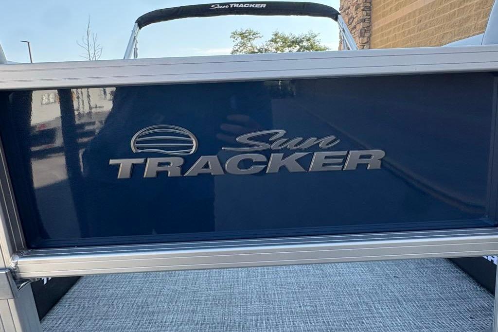 2026 Sun Tracker SportFish 22 DLX boat with logo detail.