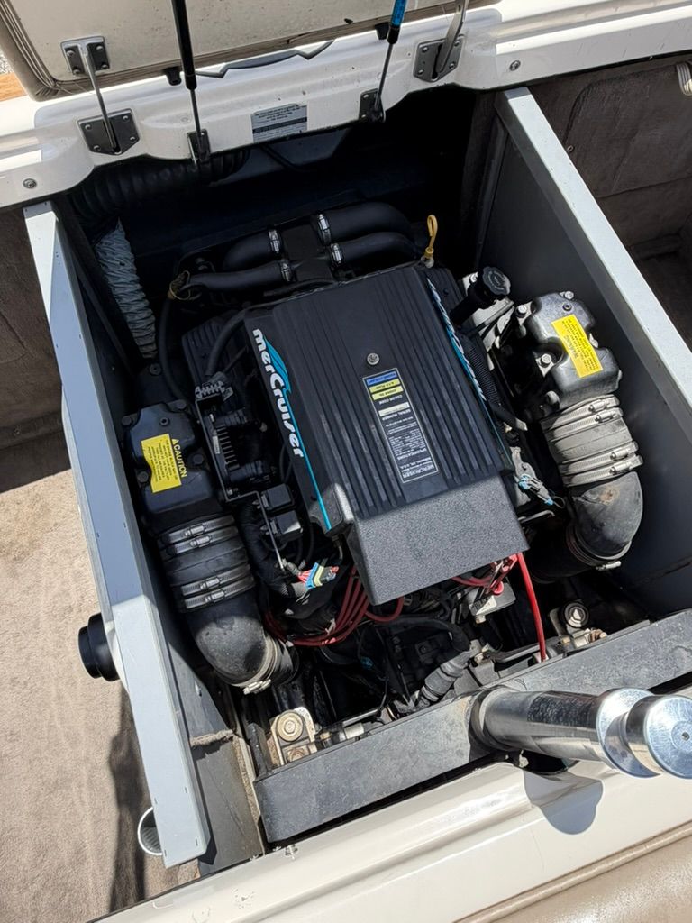 An engine compartment of a boat with a MerCruiser engine.