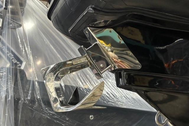 2018 Lomac Gran Turismo 10.5 boat detail with polished metal anchor.