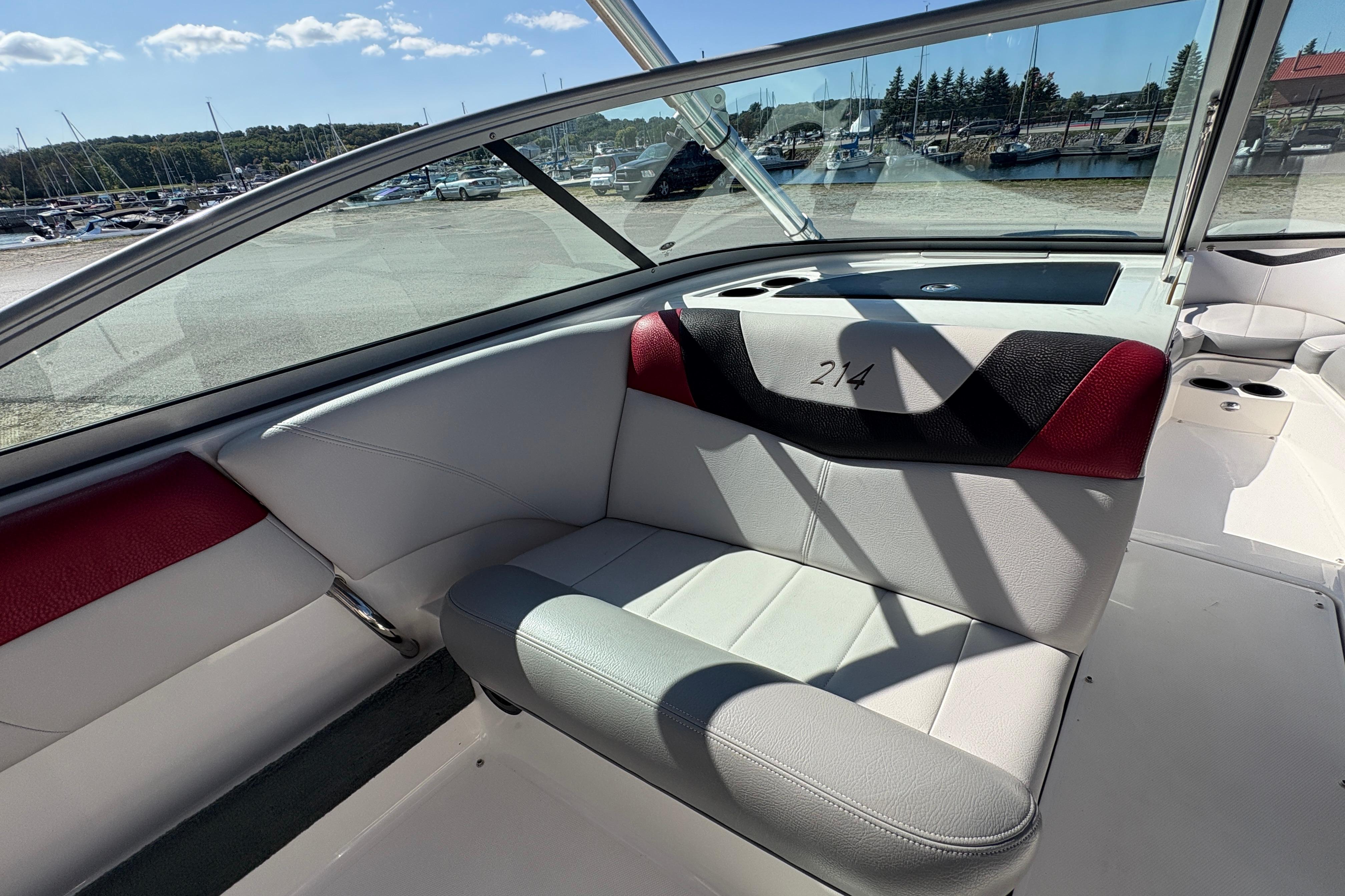 2008 MasterCraft X-14 boat interior with red and black accents, docked at marina.