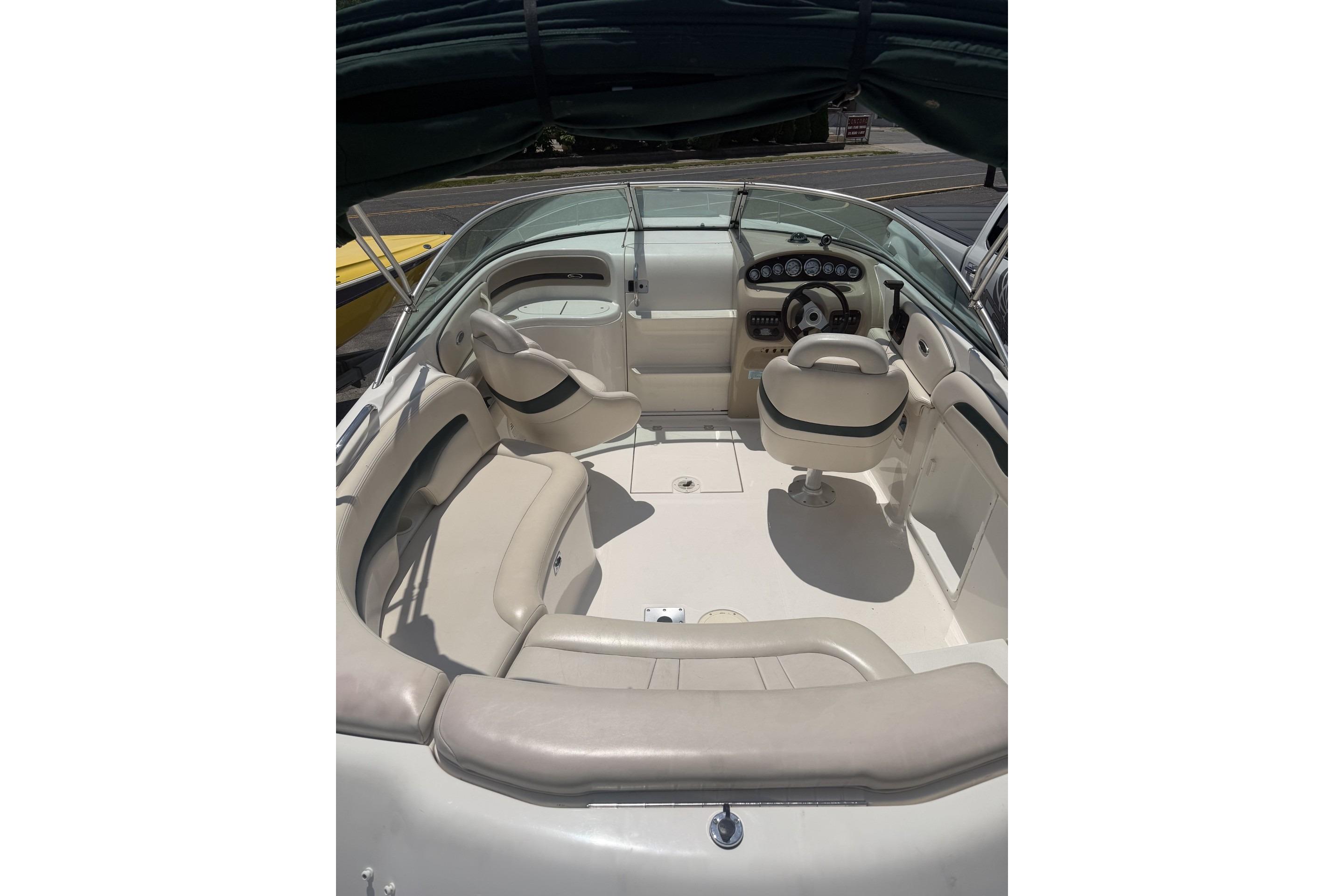 2001 Chaparral 235 SSi boat interior with seating and steering console.