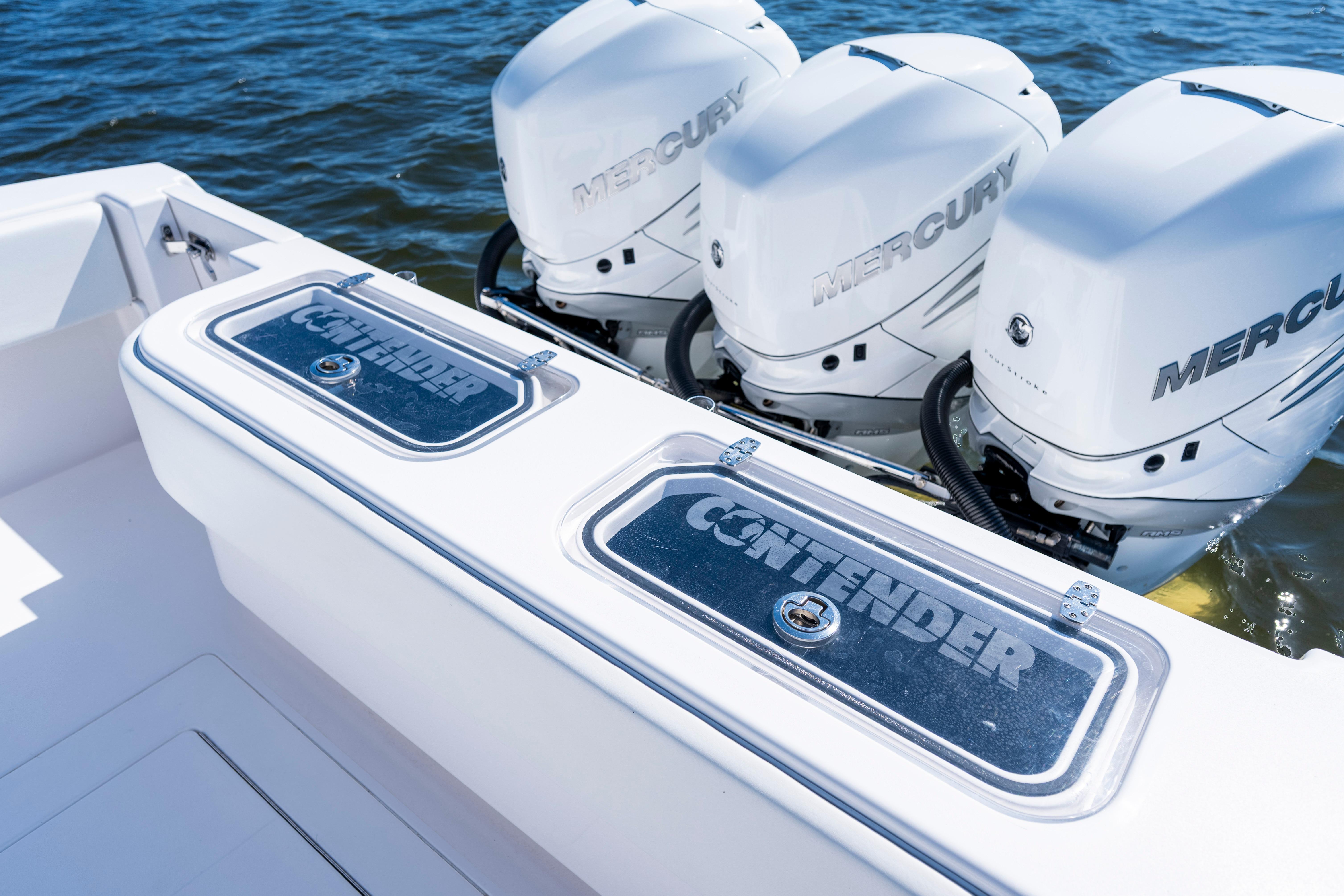 2015 Contender 39 ST boat with triple Mercury engines on water.