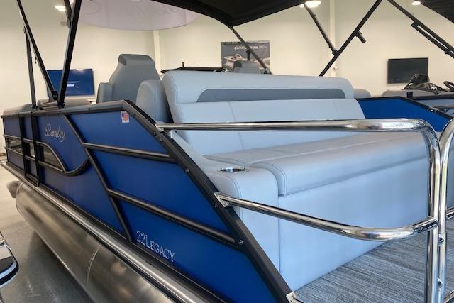 2026 Bentley Pontoons Legacy 223 Swingback with sleek blue design and comfortable seating.