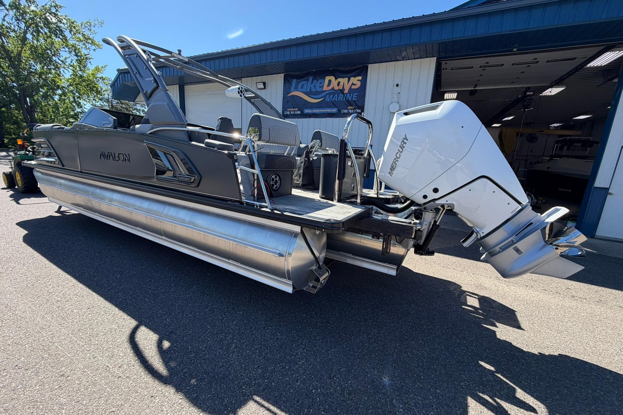 2026 Avalon Excalibur LTD Quad Lounge pontoon boat with Mercury outboard engine.