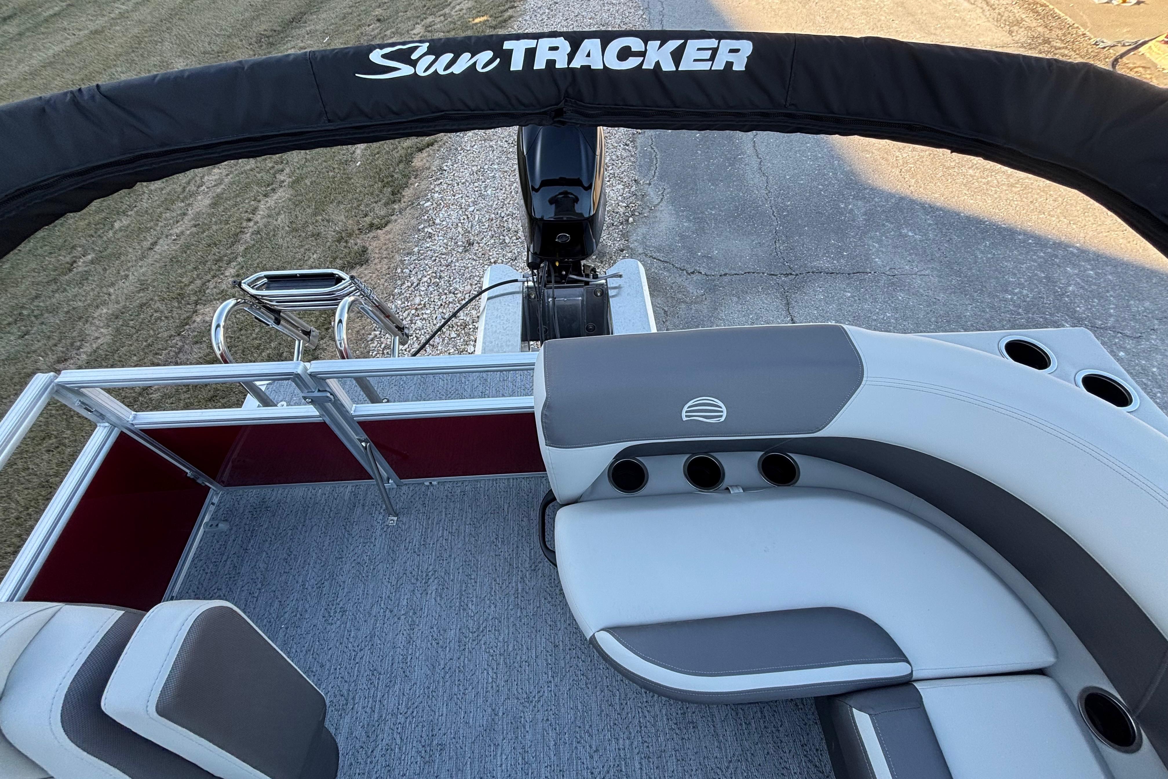 2026 Sun Tracker Bass Buggy 16 XL Select pontoon boat interior with seating and cup holders.