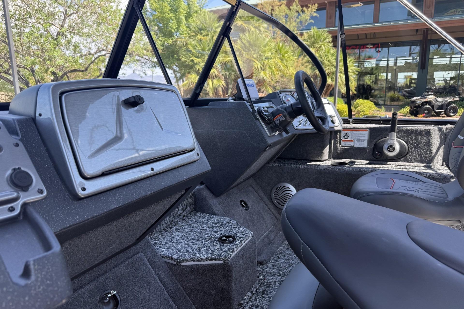 Interior of 2026 Tracker Pro Guide V-175 Combo boat with steering wheel and seating.