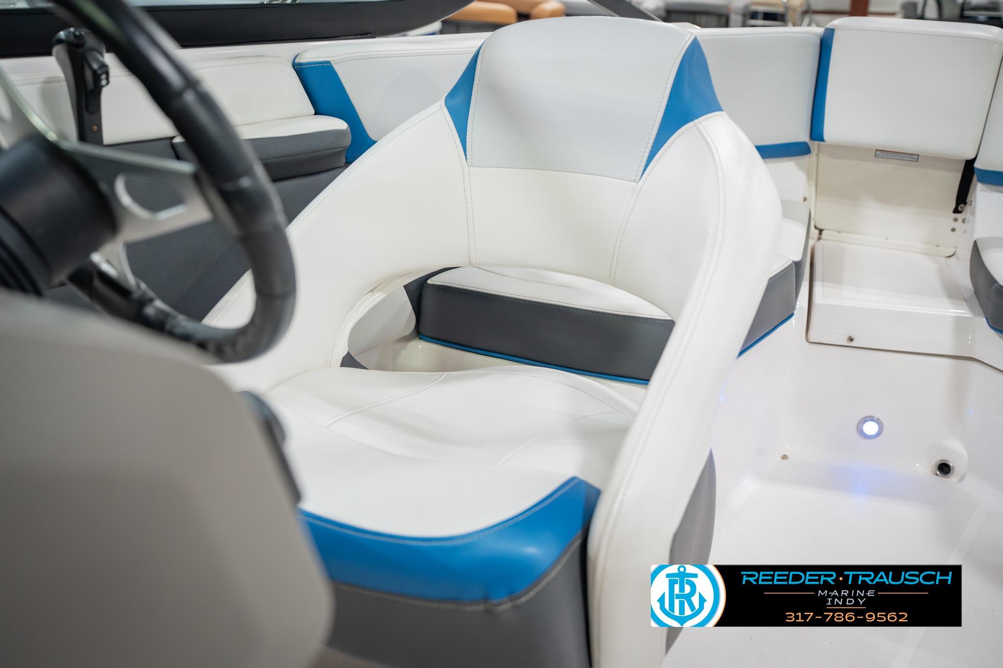 Interior of 2015 Regal 2000 ESX Bowrider with white and blue seating.