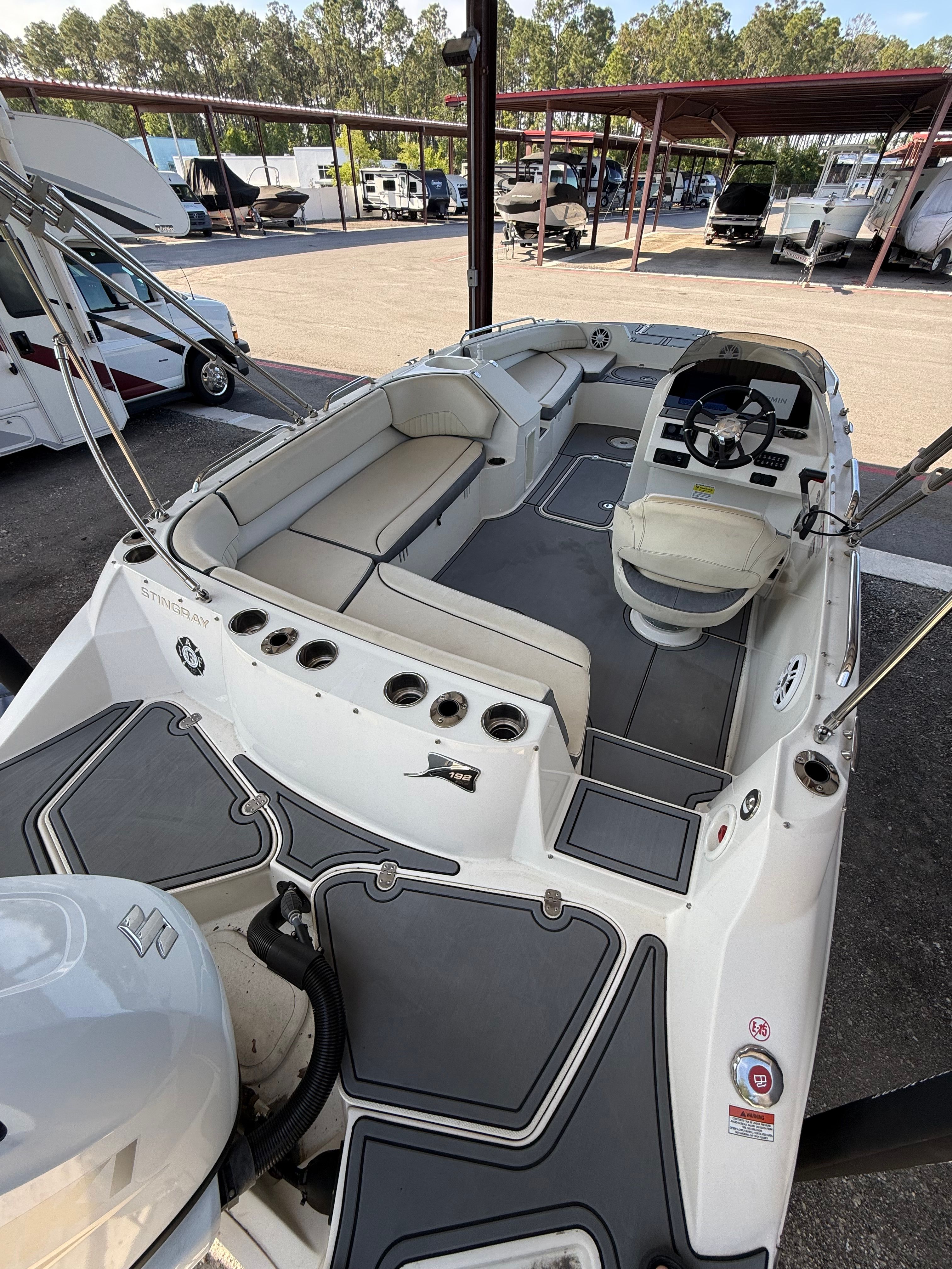 Interior view of a 2023 Stingray 192 SC boat at the dock.