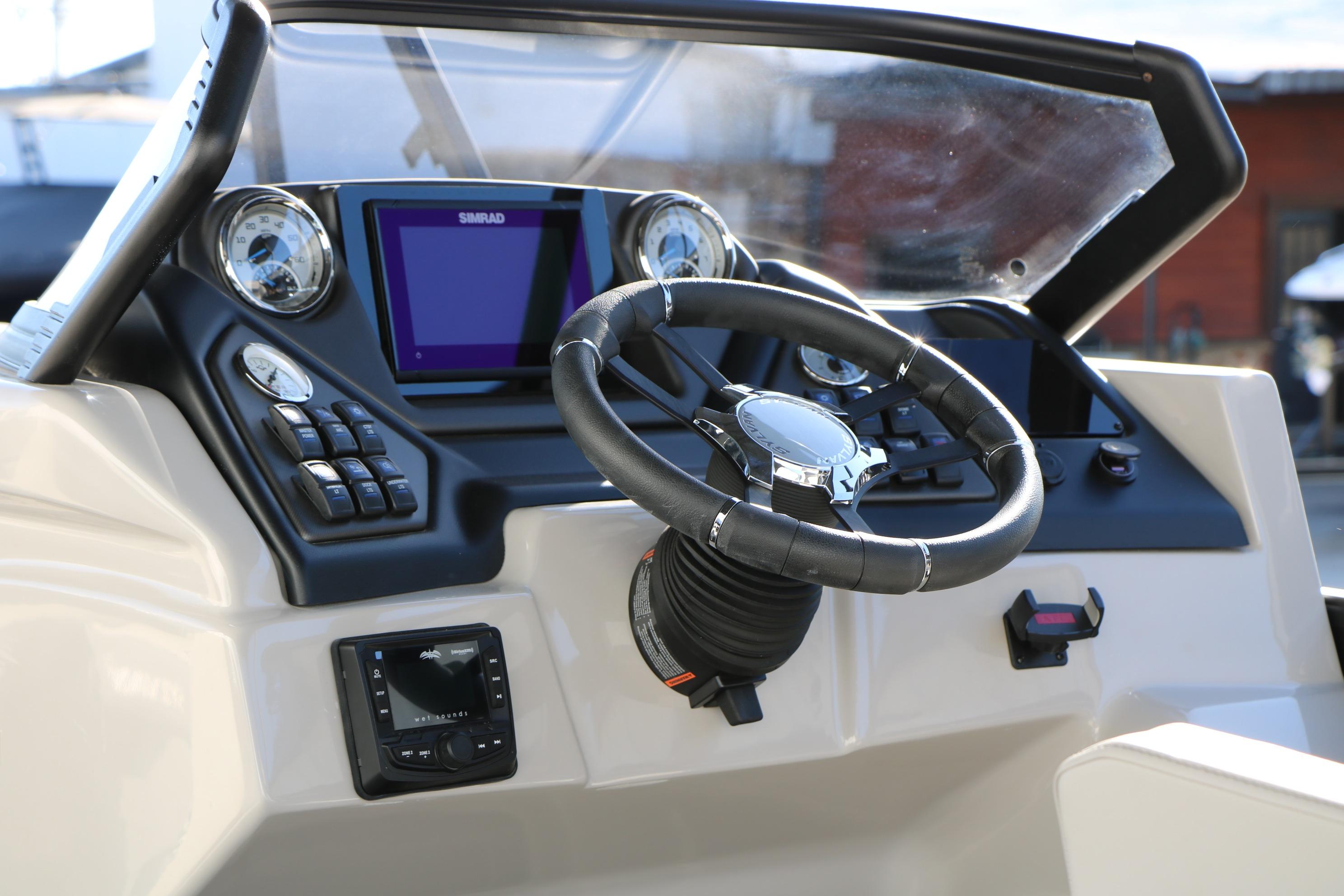 2026 Sylvan L3 CLZ DH boat dashboard with steering wheel and control panel.