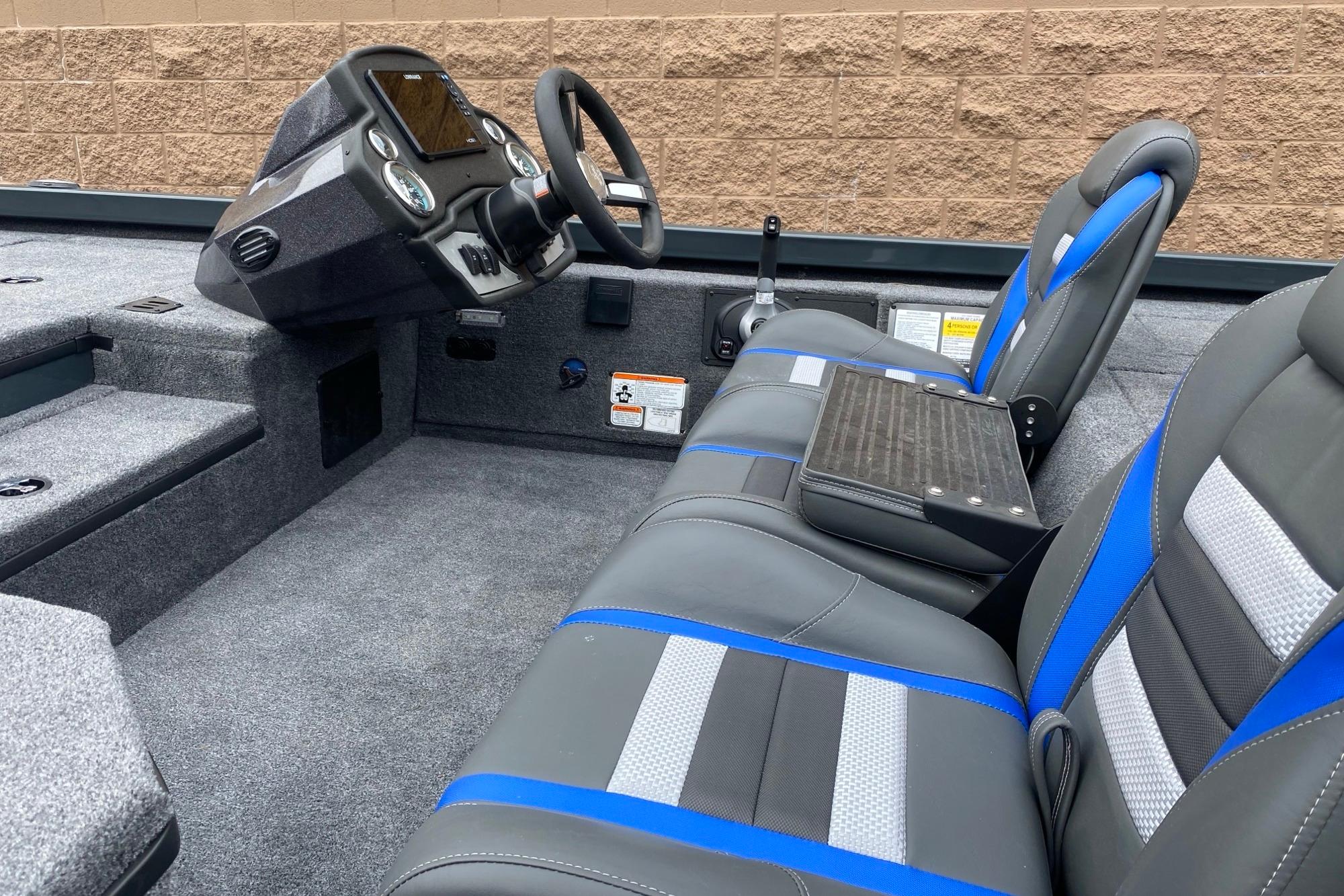 2026 Ranger RT178 boat interior with modern dashboard and blue-accented seating.