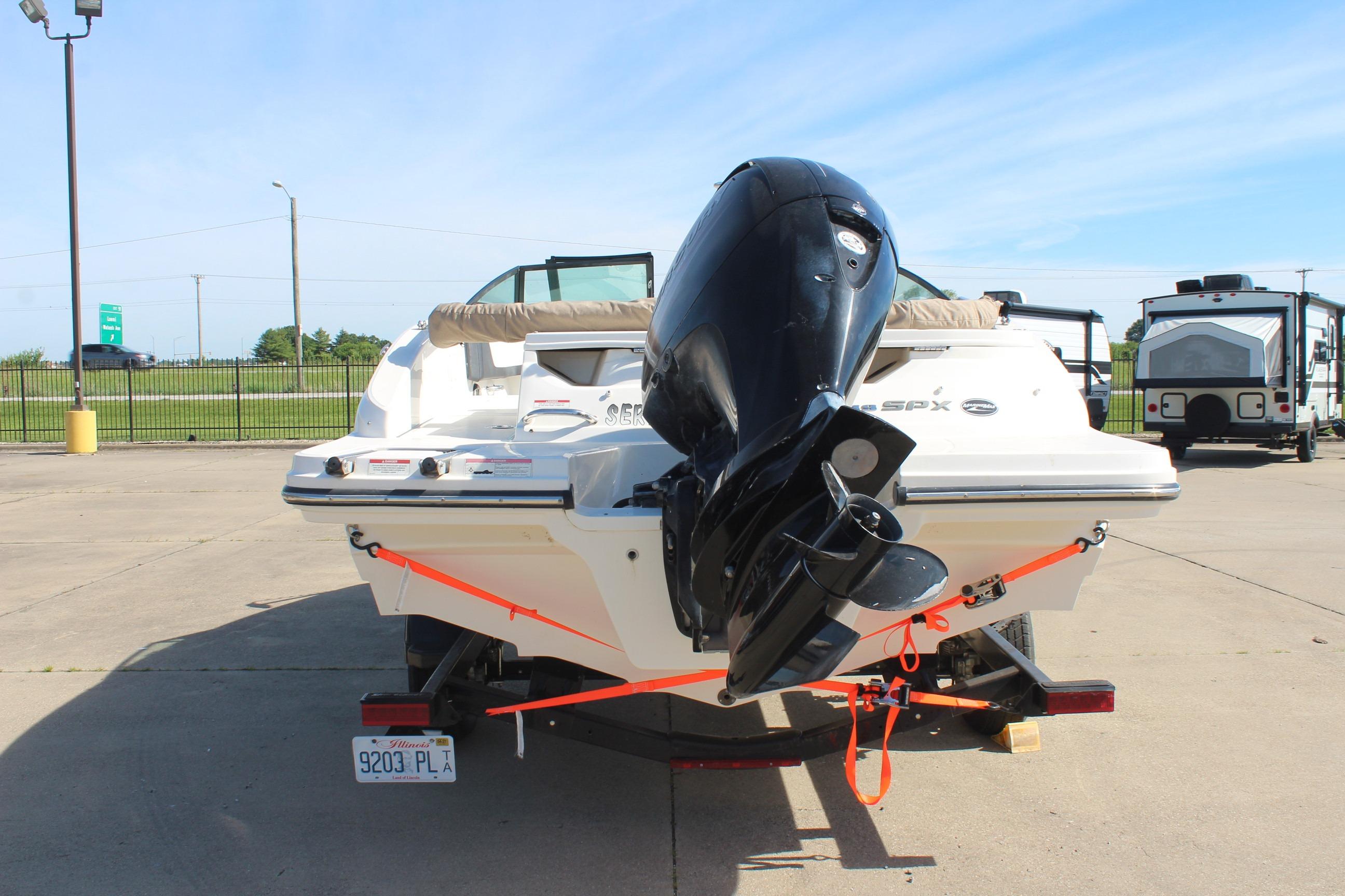 2015 Sea Ray 19 SPX OB boat on trailer, rear view with outboard motor.