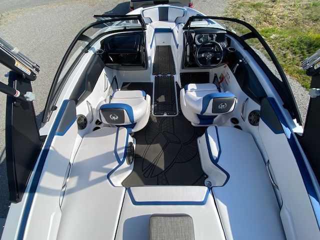 The image shows the interior of a 2024 Scarab 195 ID boat with modern seating and controls.