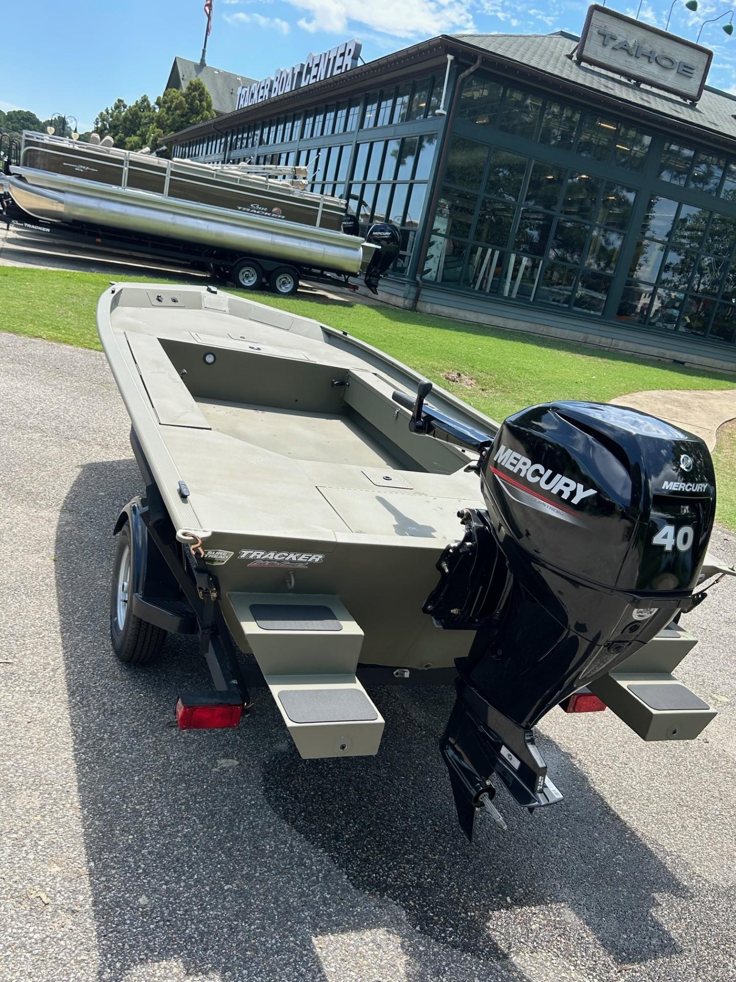 2025 Tracker Grizzly 1654 T Sportsman boat with Mercury 40 engine at dealership.