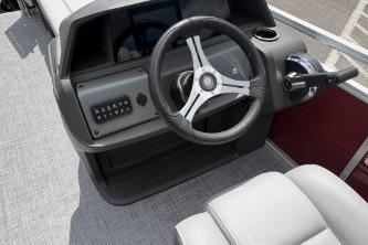 2026 Sun Tracker SportFish 20 DLX boat dashboard with steering wheel and controls.