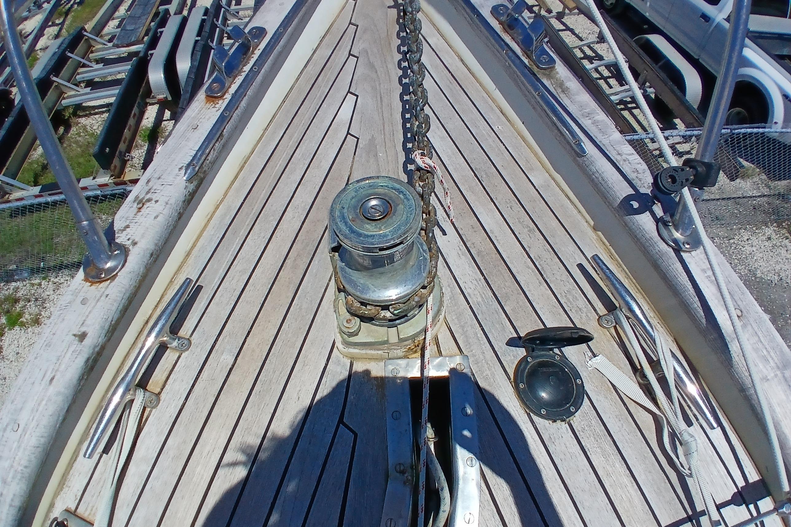 Deck of 1981 Kaufman Skye 51 sailboat with winch and chain.