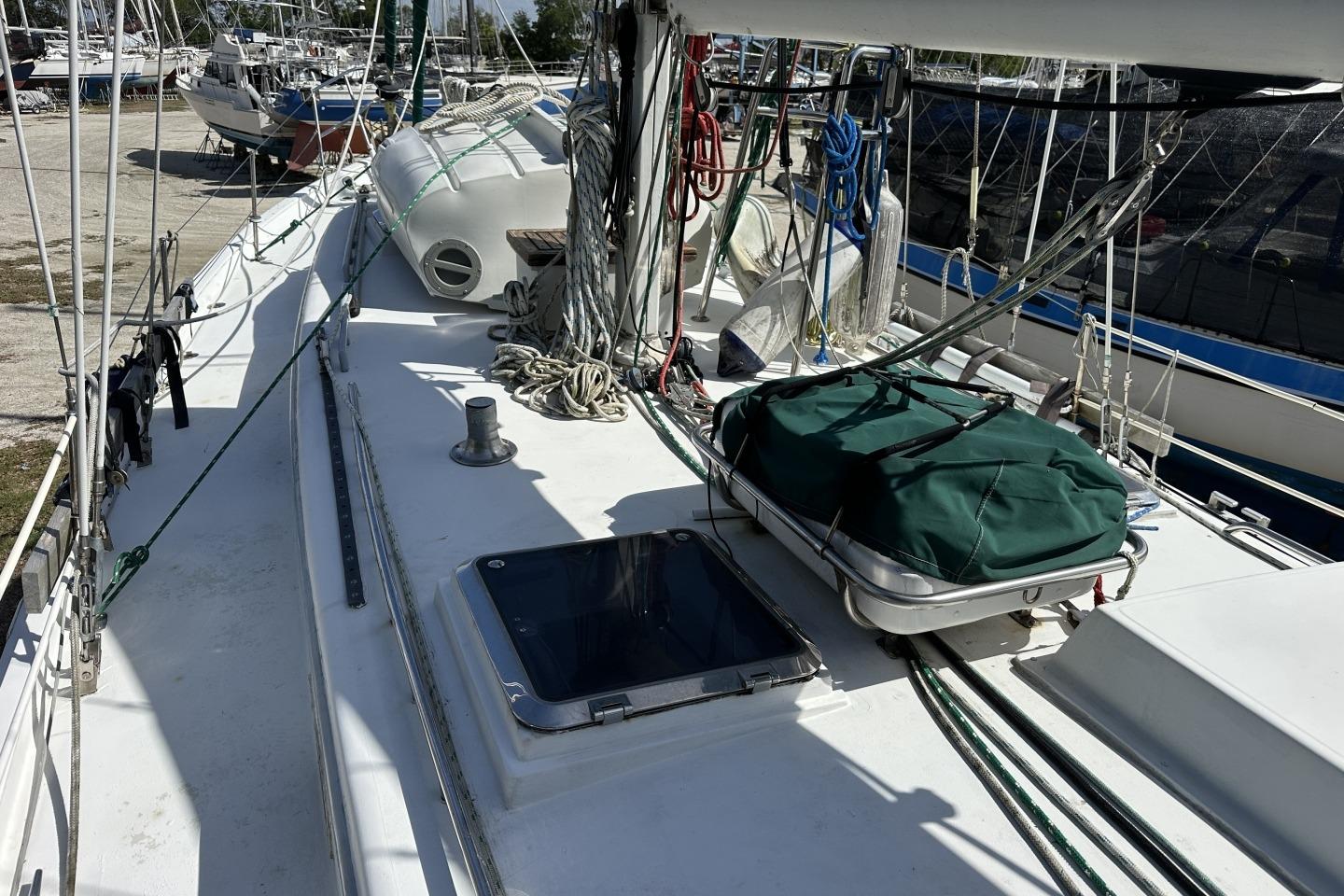 1976 Valiant 40 sailboat deck with ropes and equipment in a marina.