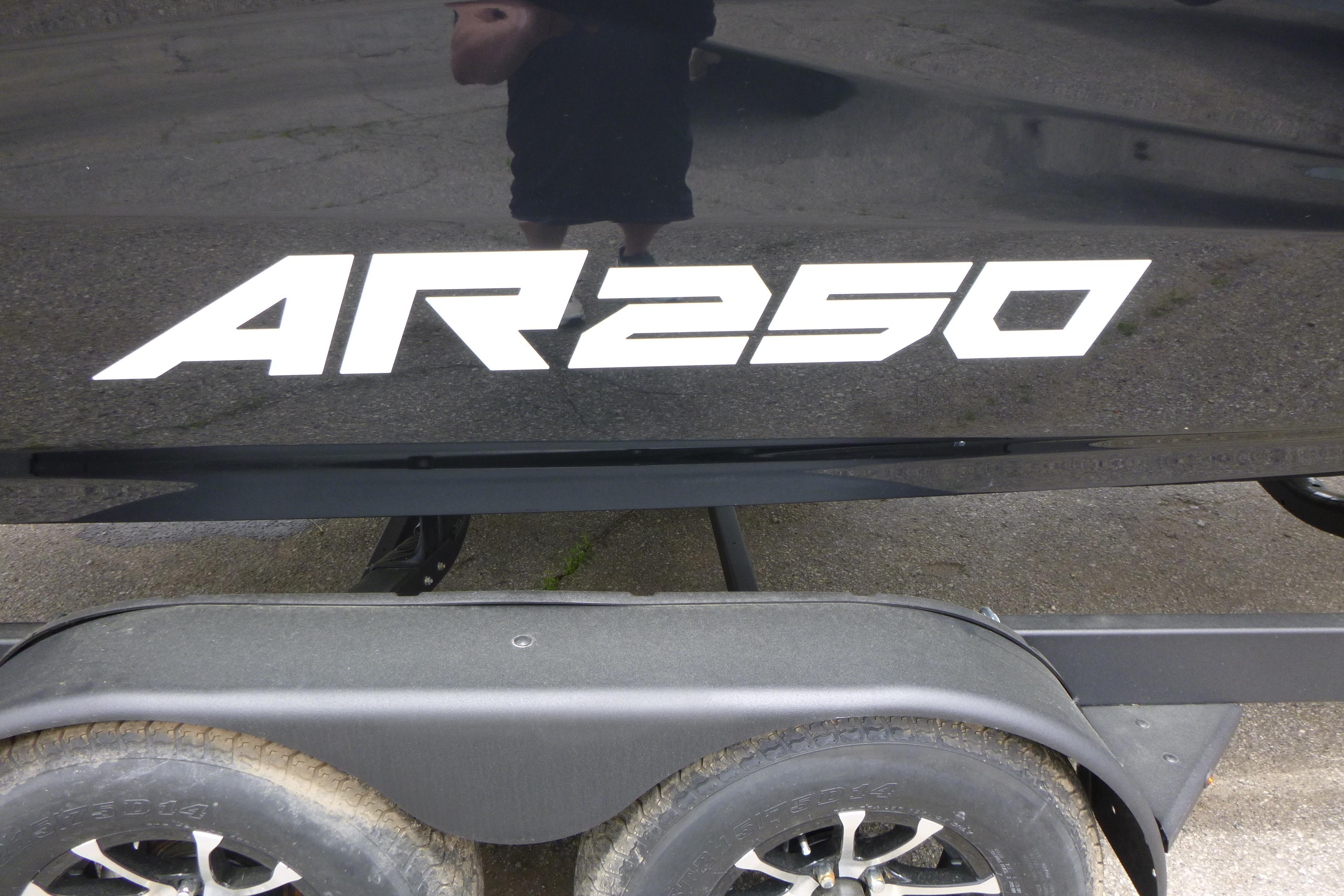 2026 Yamaha Boats AR250 logo on a black boat hull above trailer wheels.