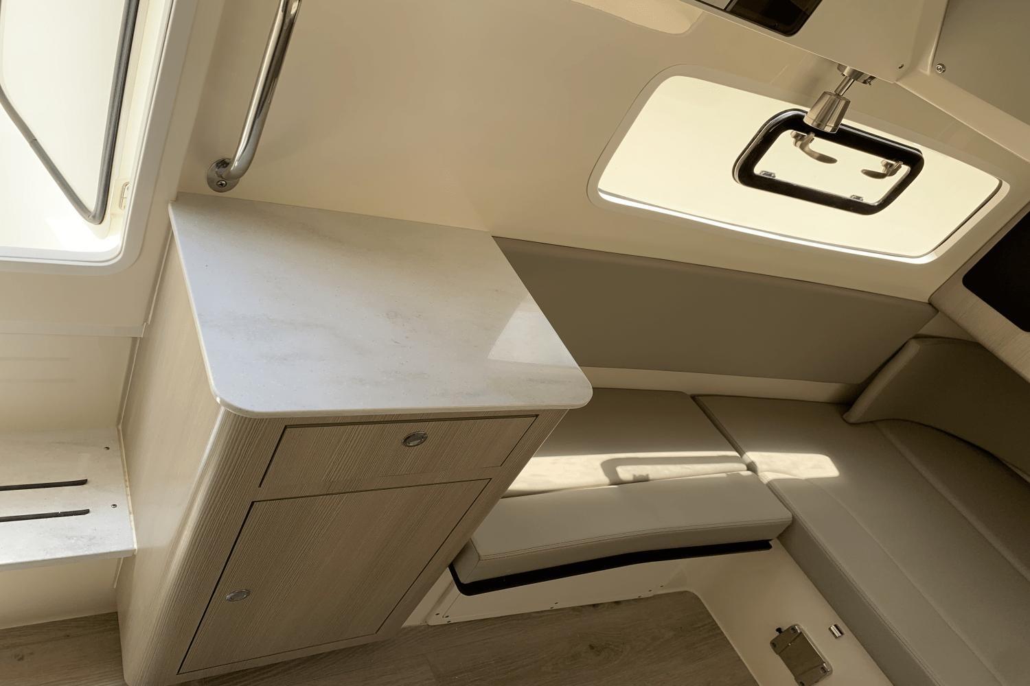 2024 Scout 357LXF interior with sleek cabinetry and seating, featuring modern design elements.