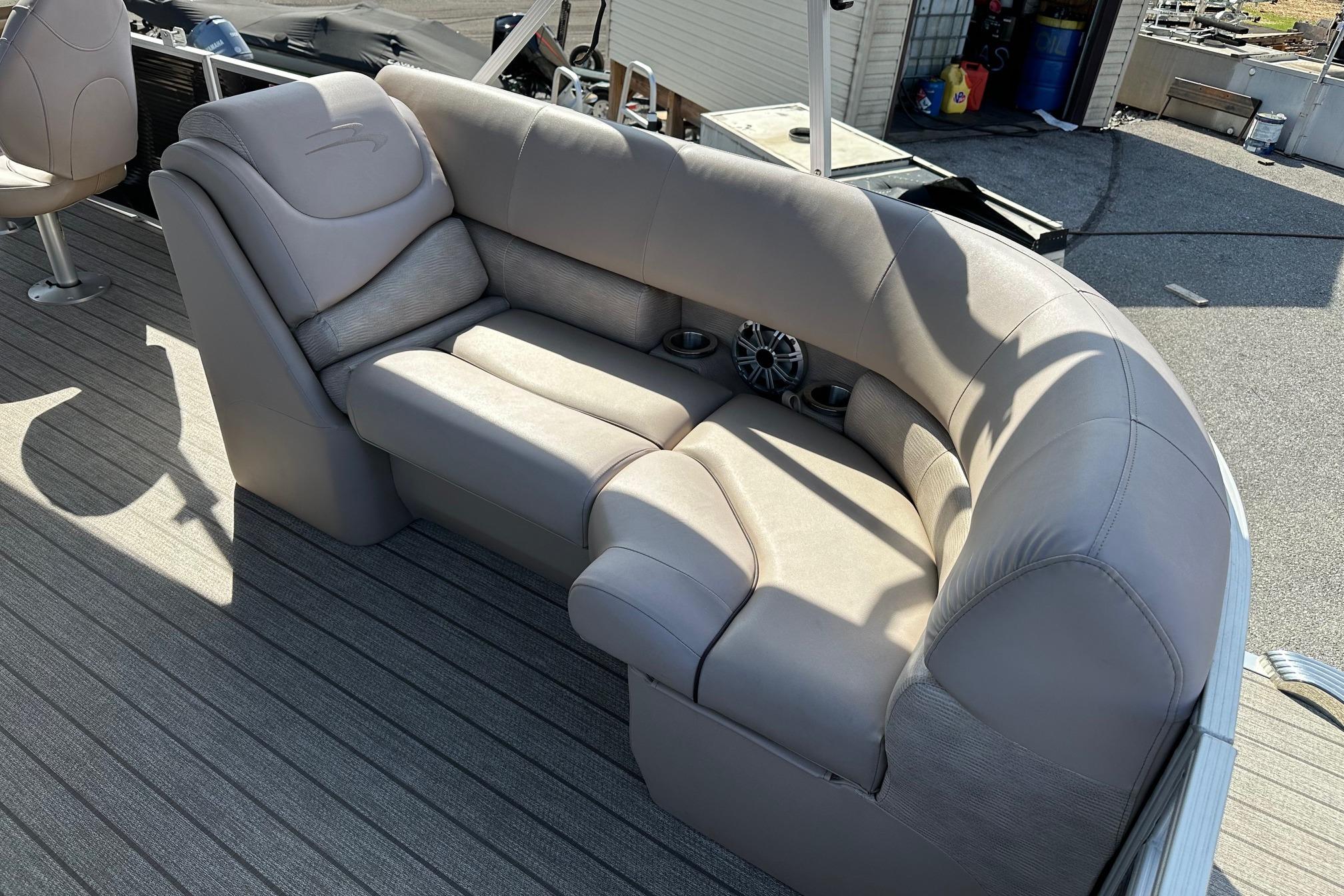2017 Bennington 22 GPD boat interior with plush seating and cup holders.