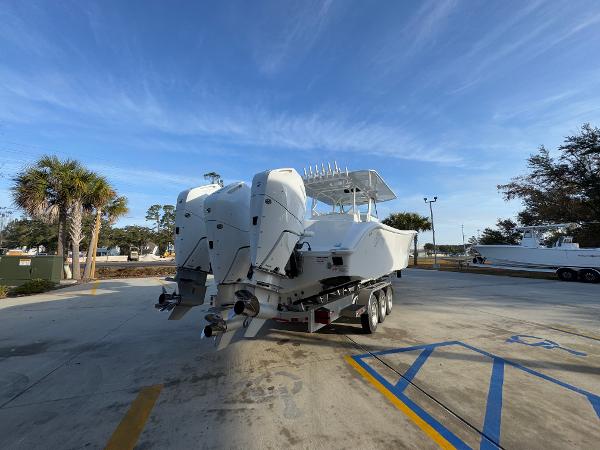 2025 Yellowfin 39 Offshore boat on trailer, parked outdoors under clear sky.