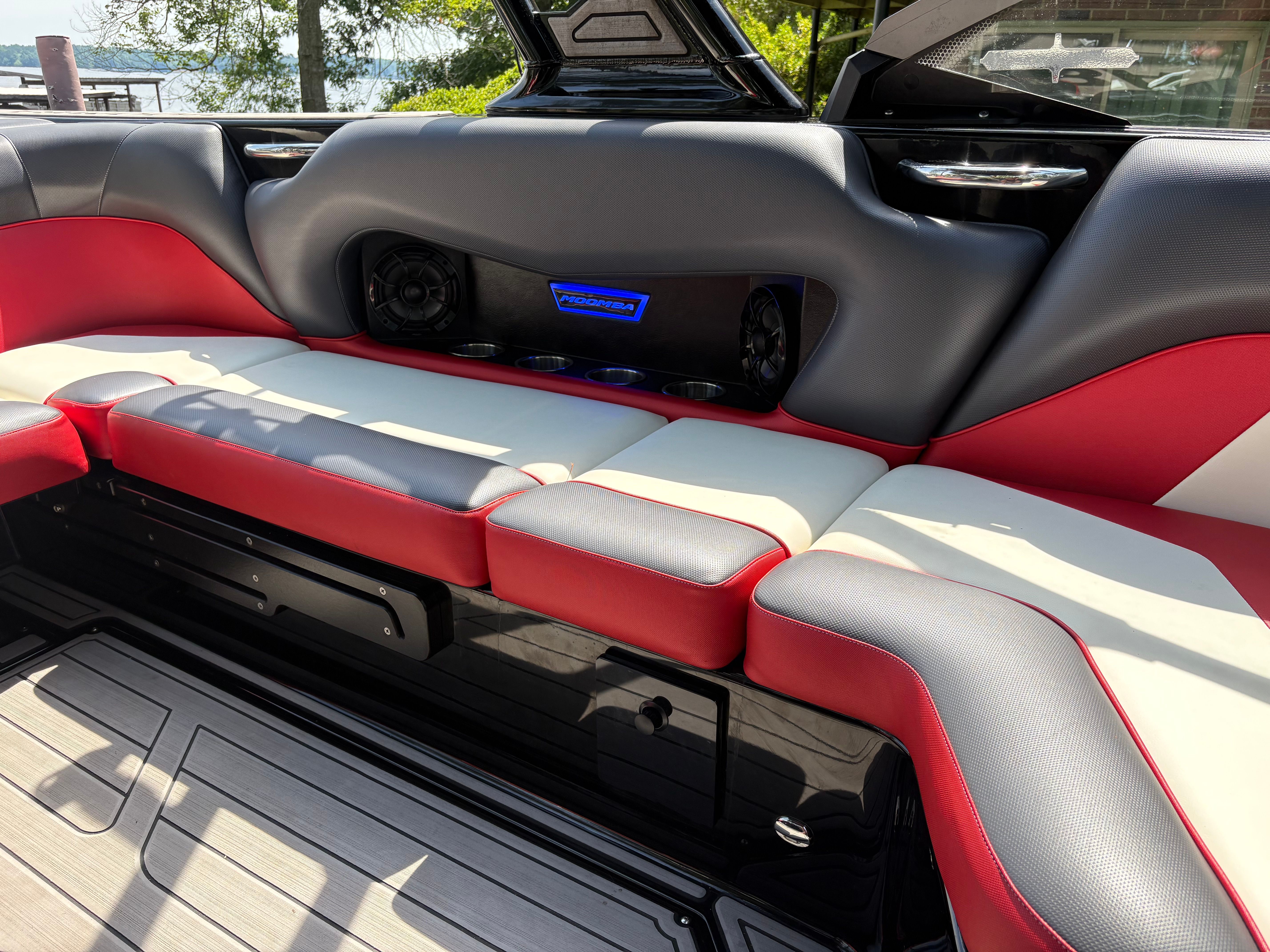 Interior of a 2021 Moomba Craz boat with red and gray seating.