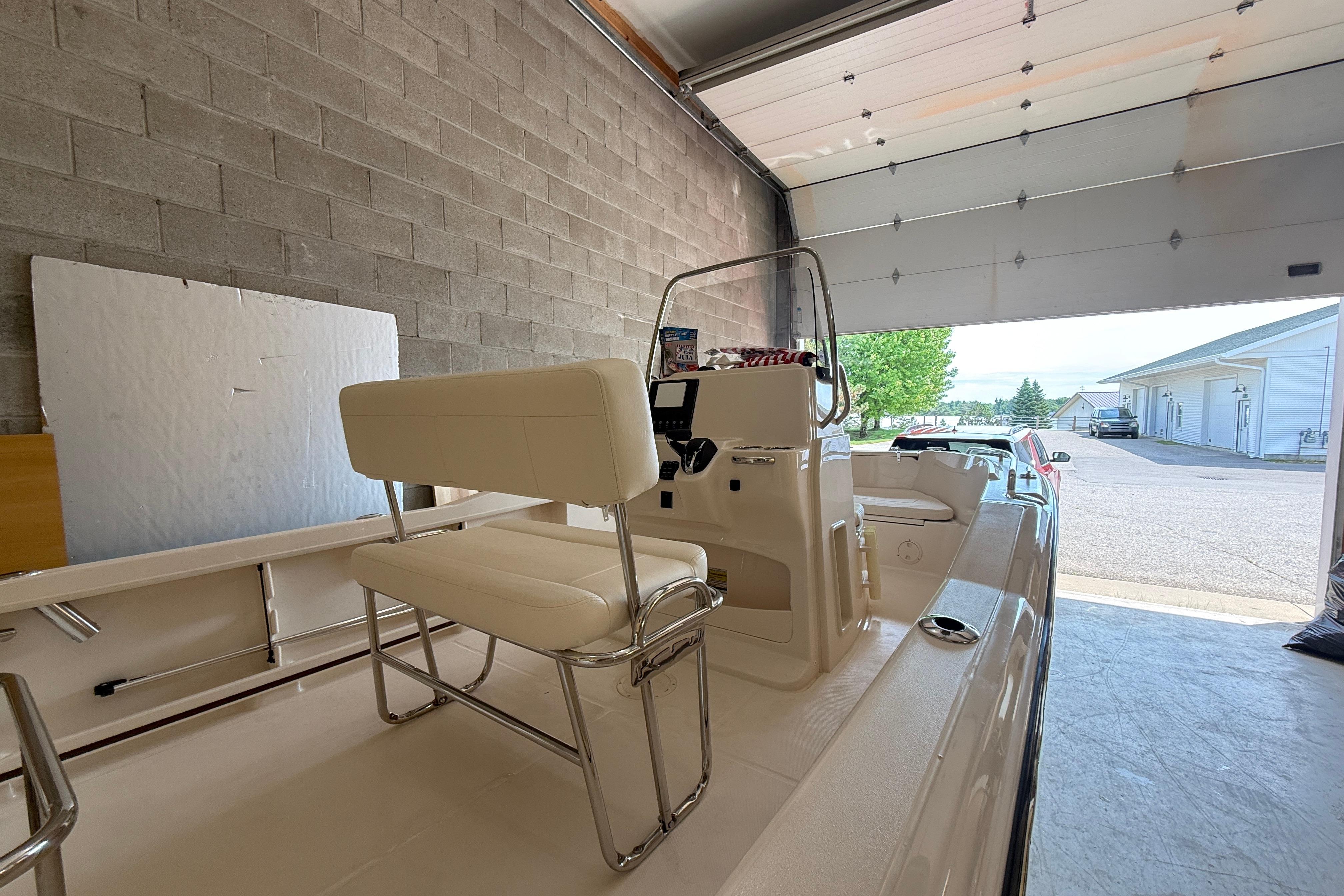 2025 Grady-White Fisherman 180 boat in garage, showcasing interior seating and console.