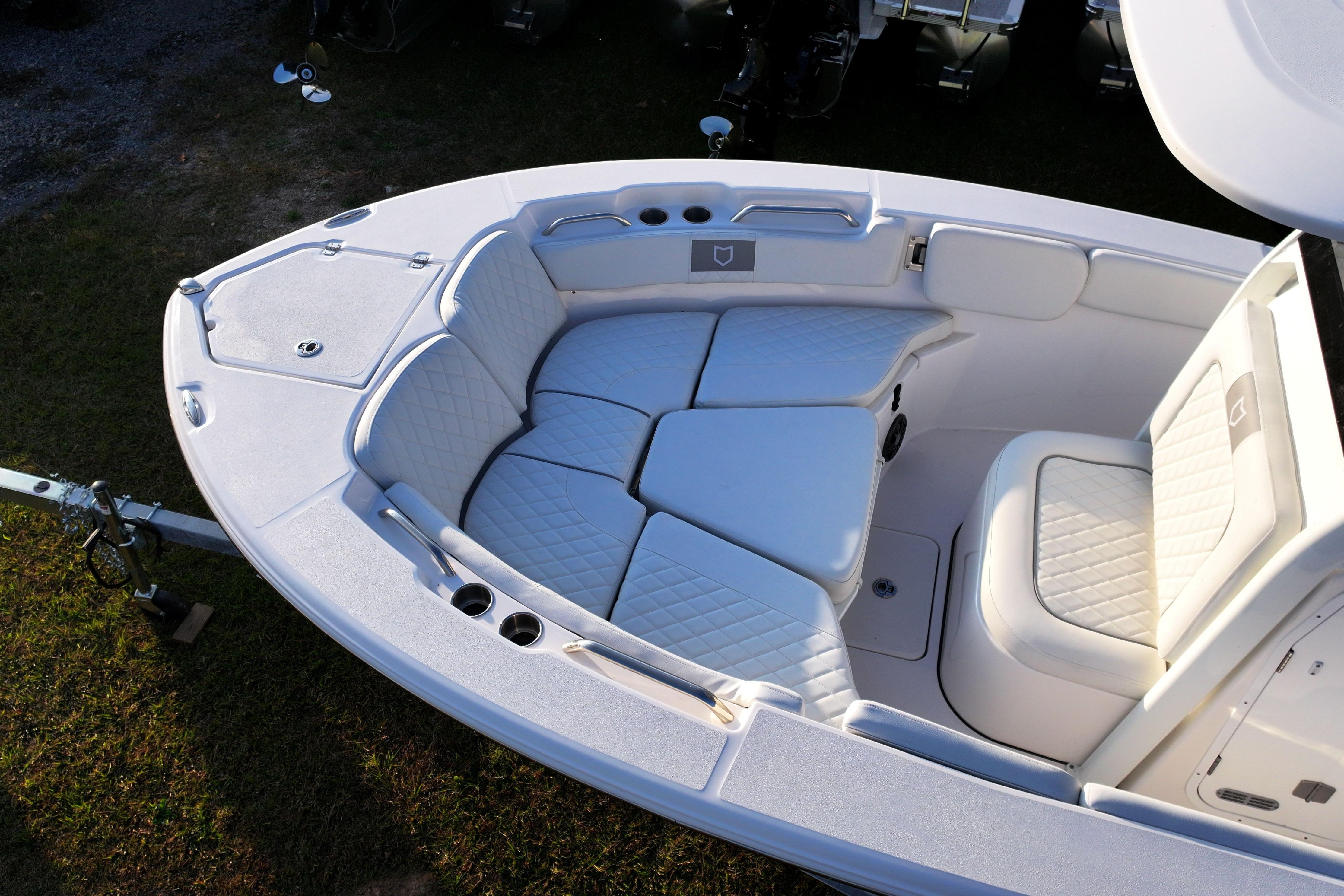 2026 Sea Fox 228 Commander boat interior with cushioned seating and storage compartments.