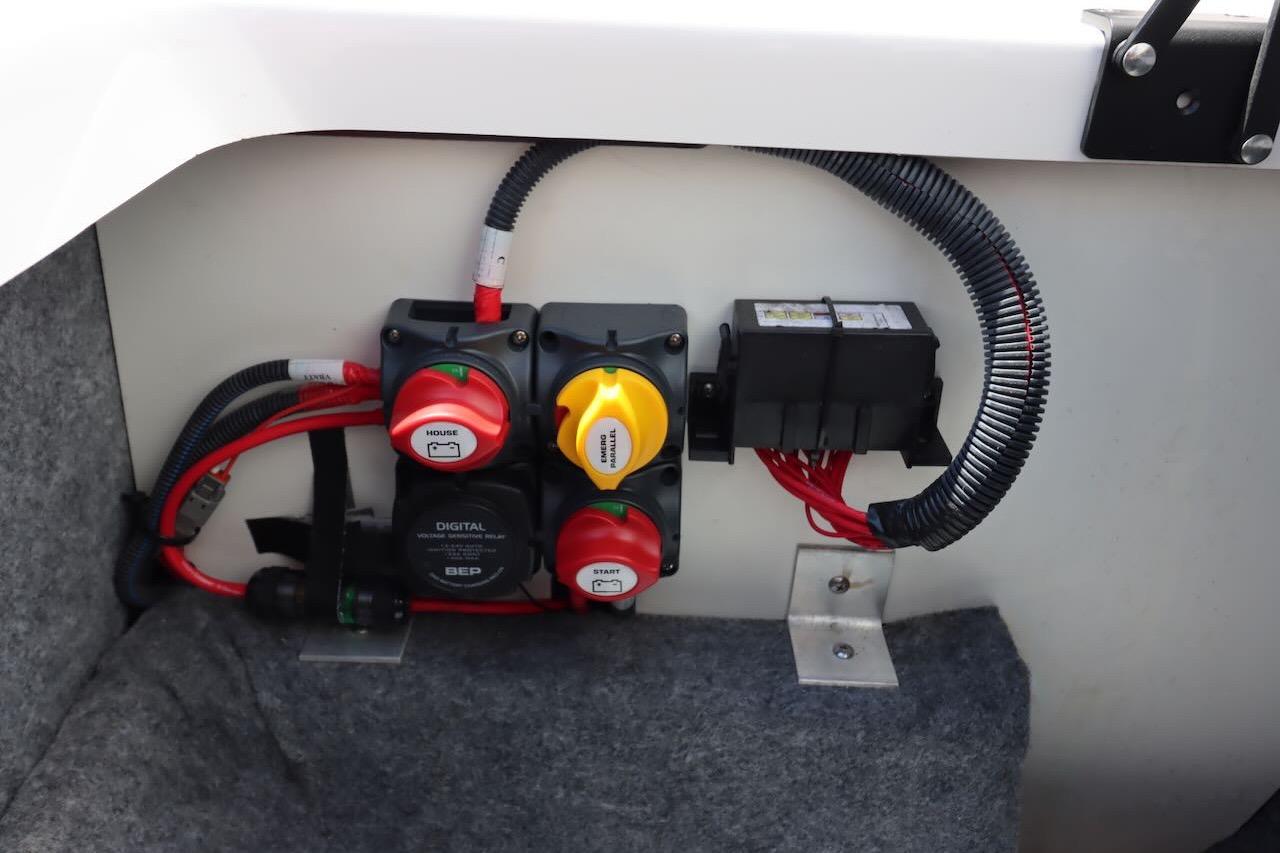 Electrical panel of 2023 Yamaha Boats AR250, featuring switches and wiring components.