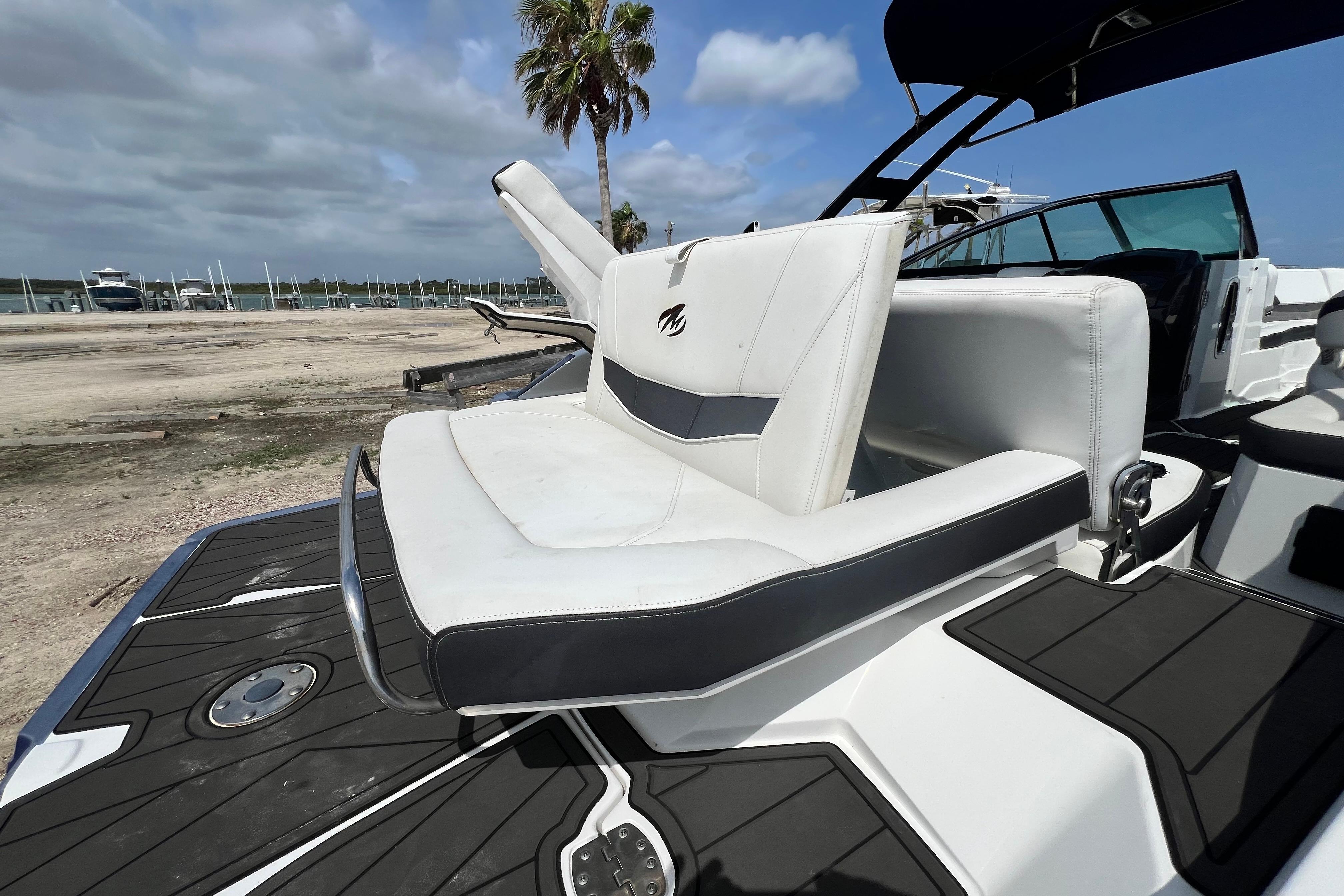 2015 Monterey 268SS Super Sport boat with white seating and sleek design.
