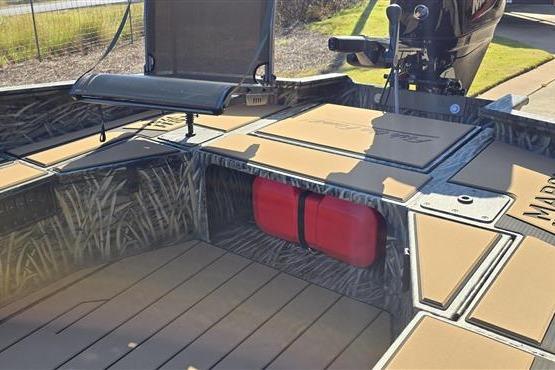 2026 Tracker Grizzly 1756 T Marsh boat interior with camo design and seating.