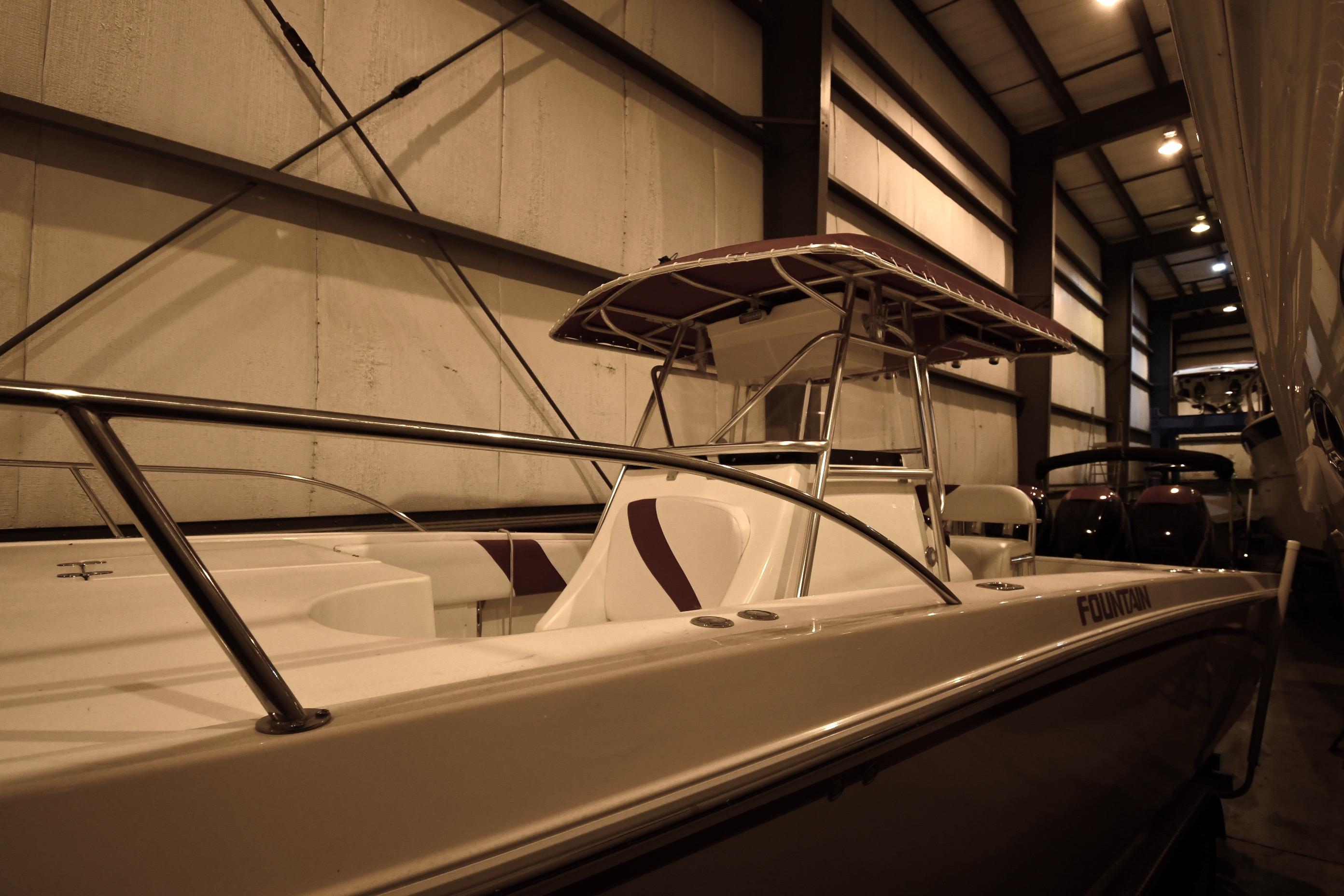 2001 Fountain 38 Center Console boat in indoor storage facility.