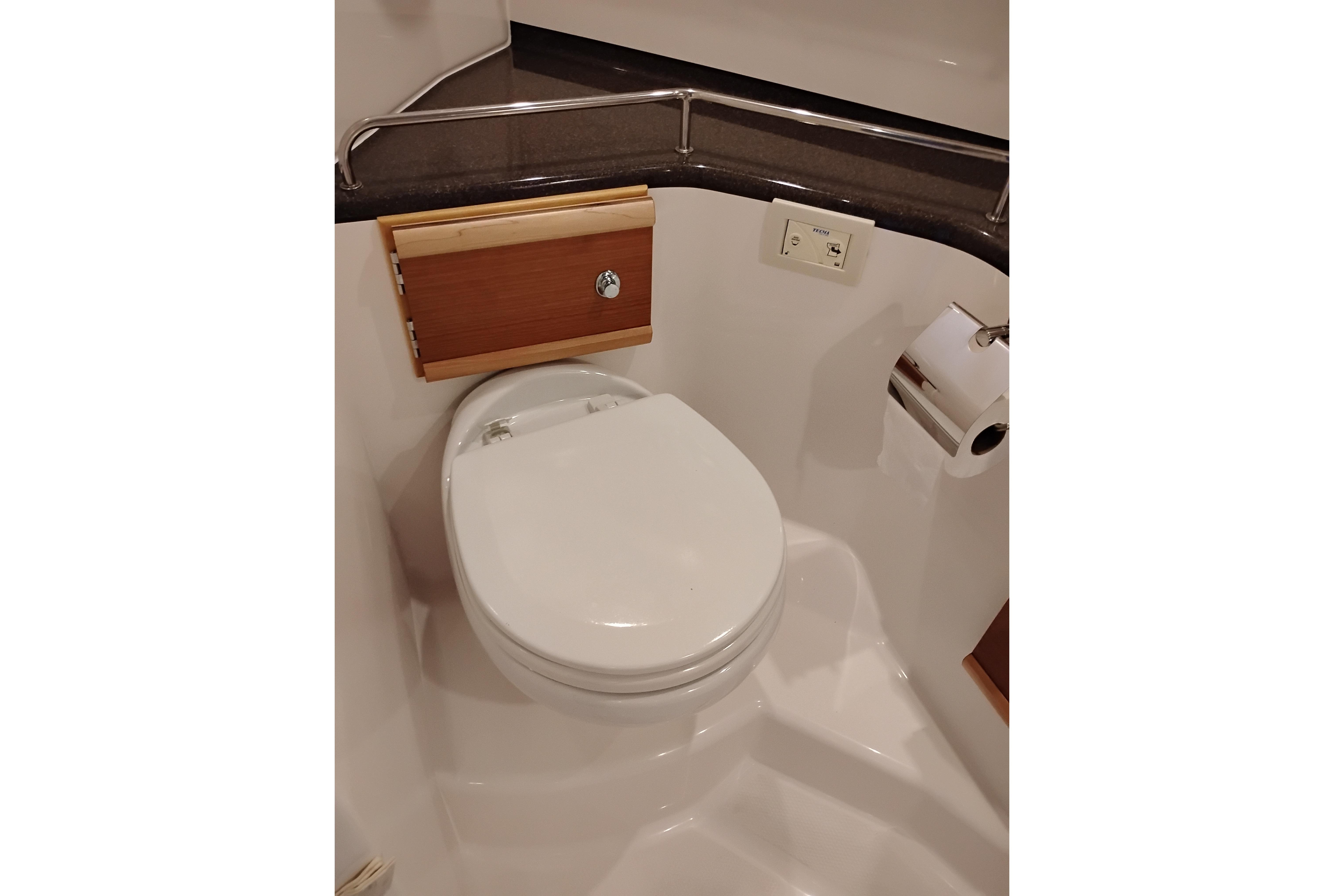 2022 Cutwater C-32 Coupe bathroom with modern toilet and sleek design.