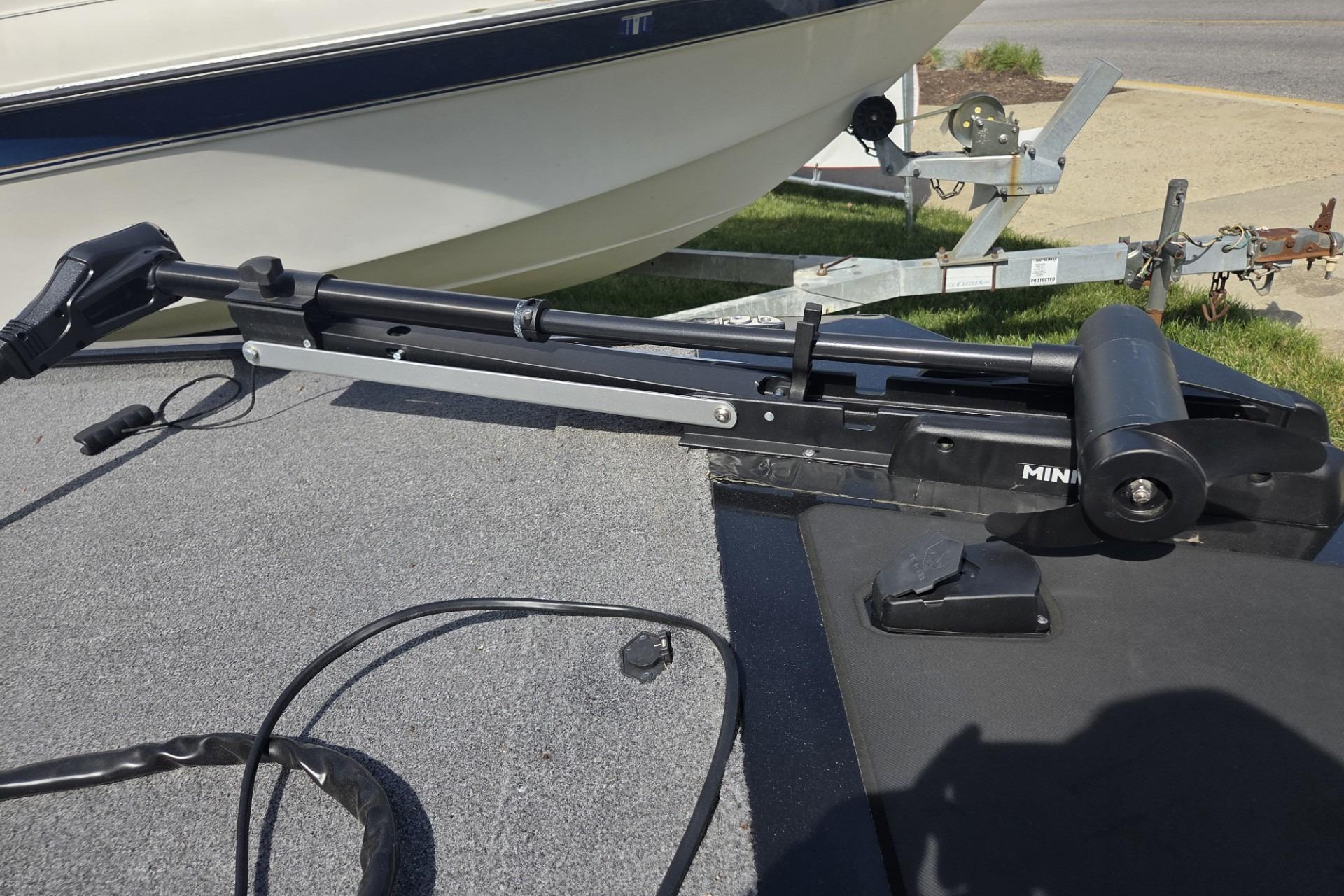 2024 TRACKER MARINE CLASSIC XL boat with trolling motor on deck.