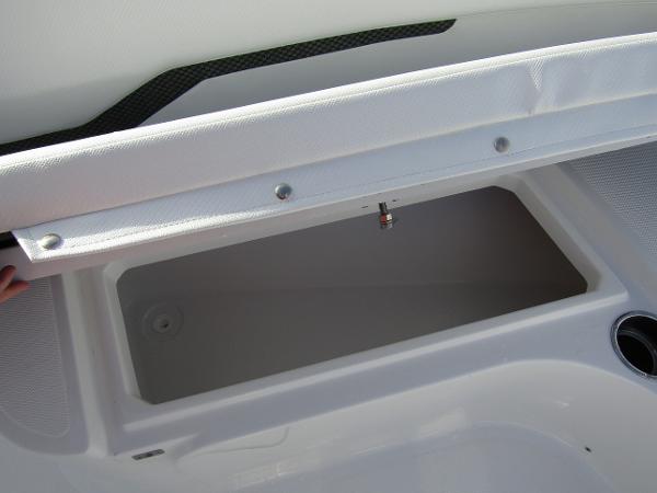 2025 Wellcraft 243 Fisherman boat storage compartment, open lid view.